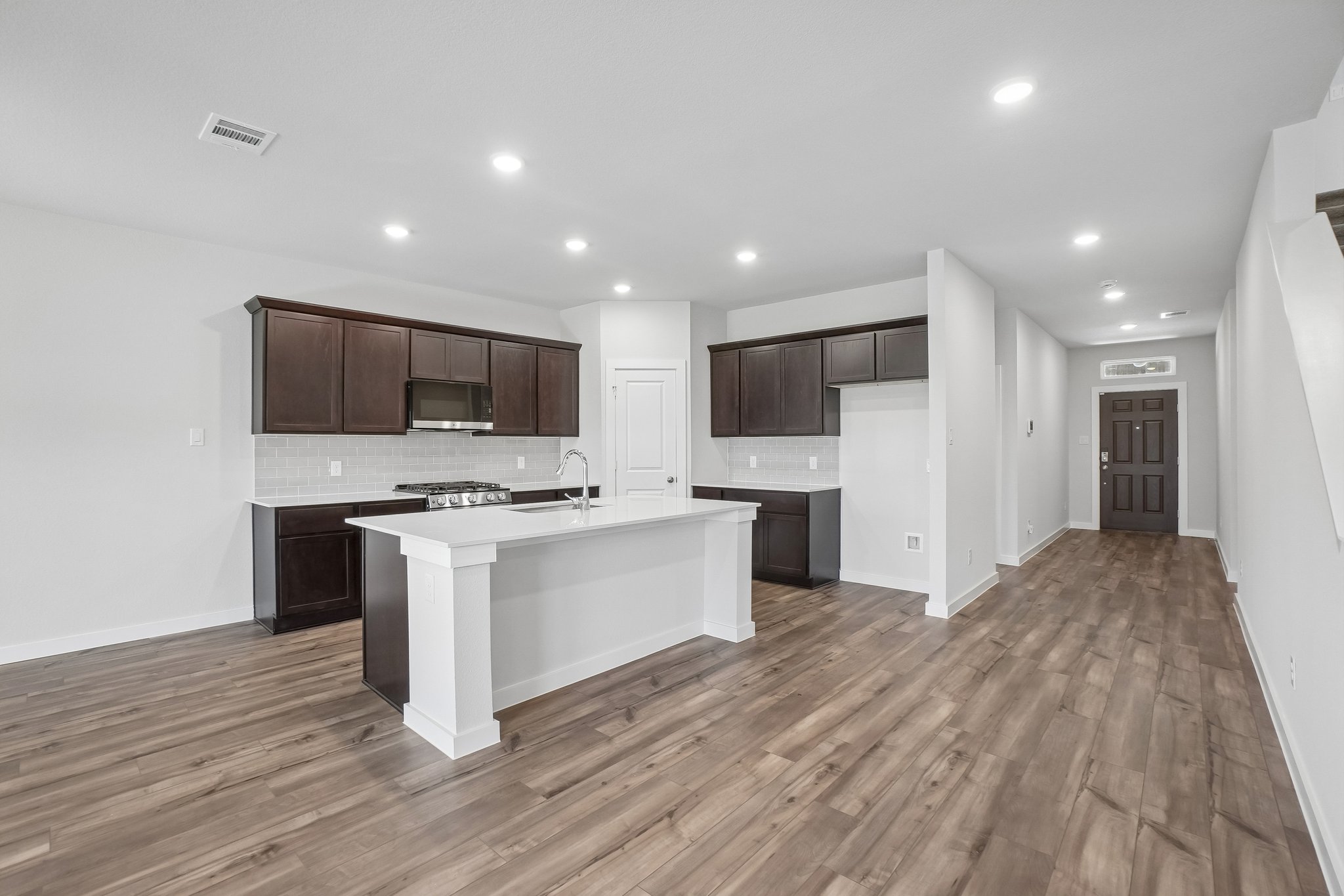 A kitchen with wooden floors.