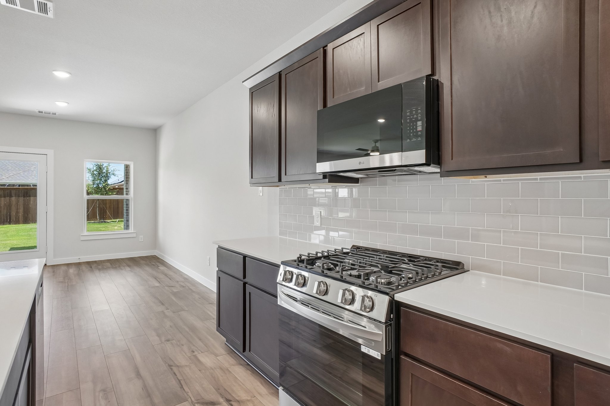 A kitchen with black cabinets.