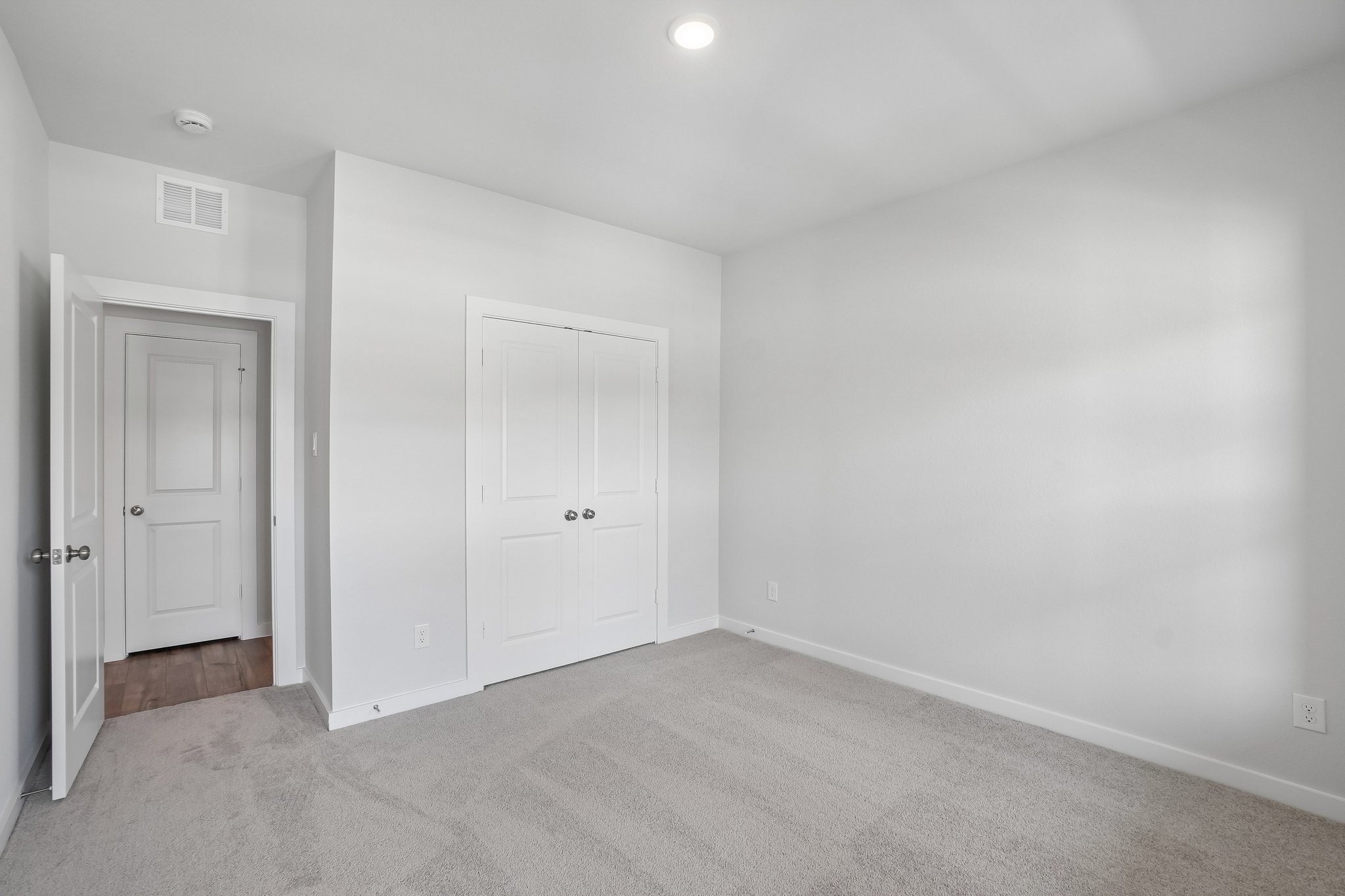 A room with white doors.