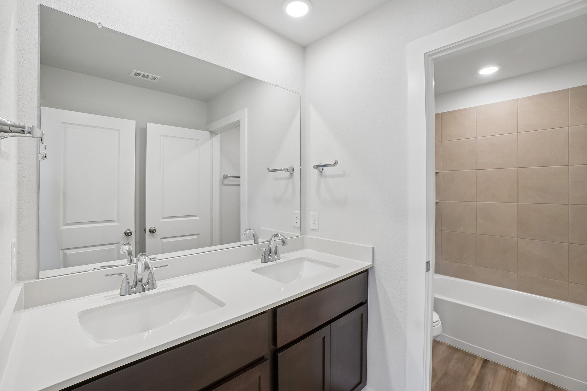 A bathroom with a sink and a bathtub.