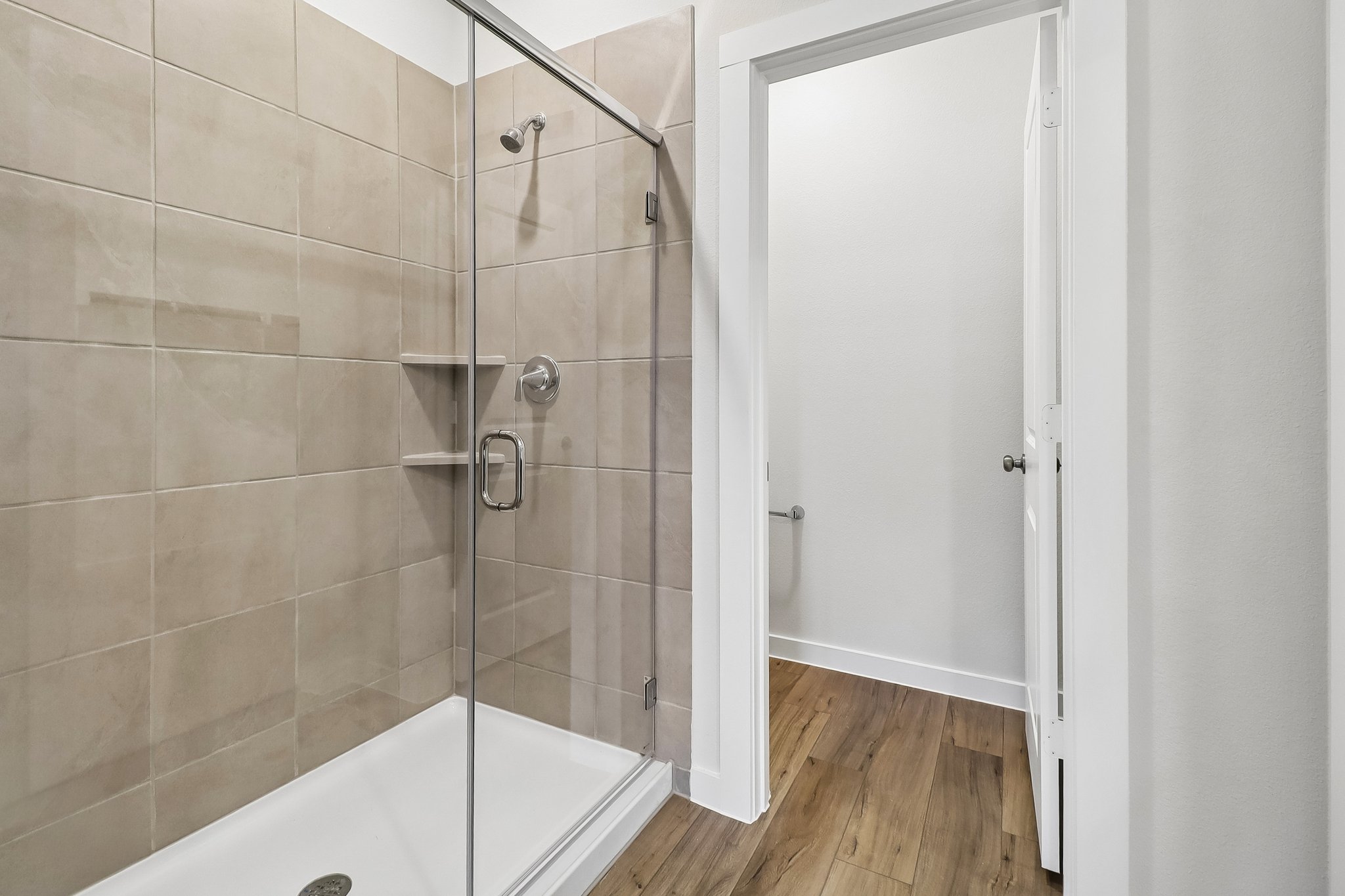 A bathroom with a glass shower.