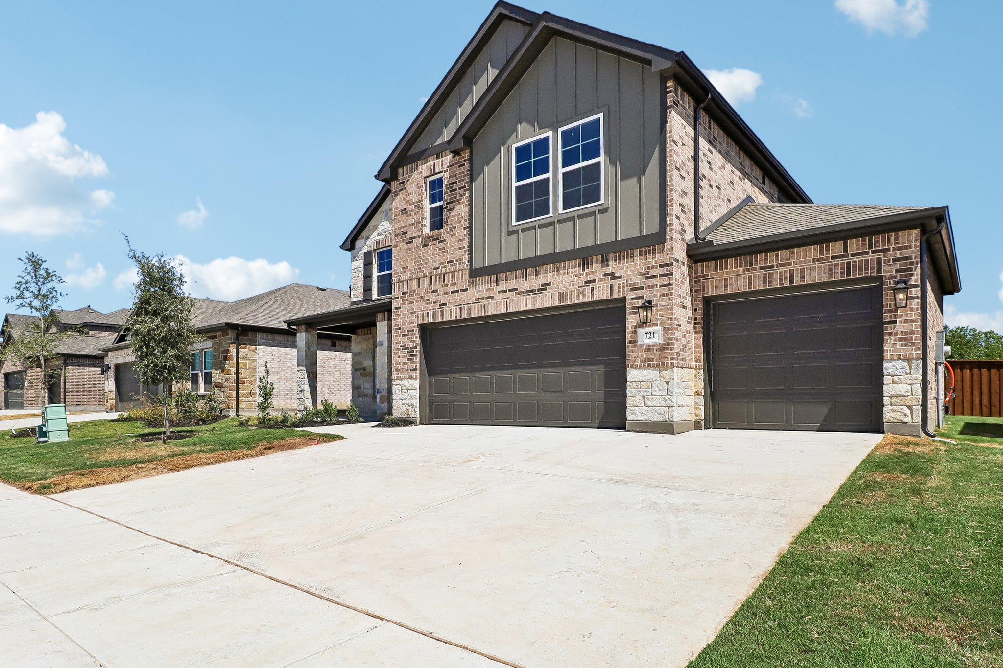 A house with garages and a driveway.