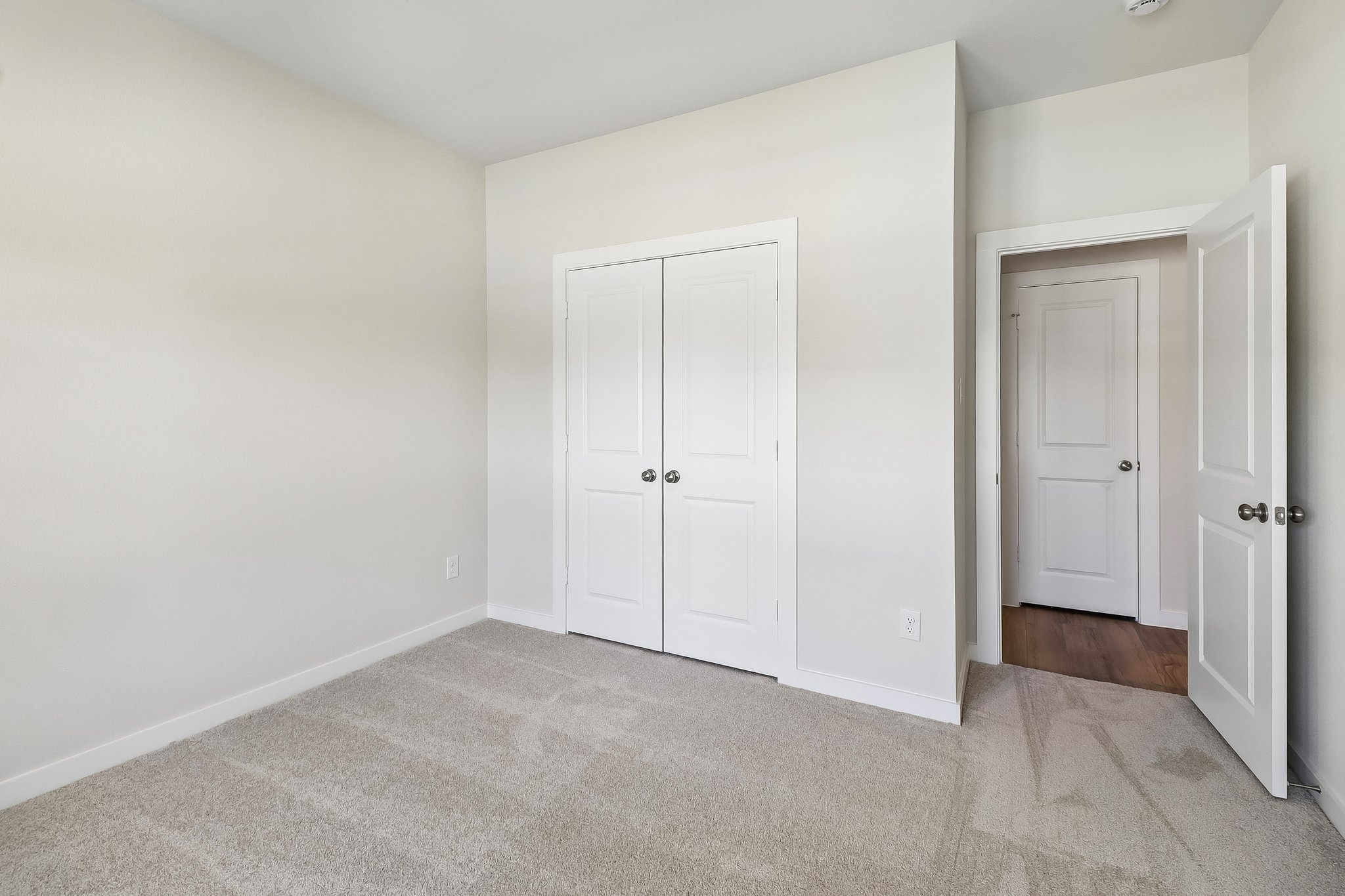 A room with white doors.