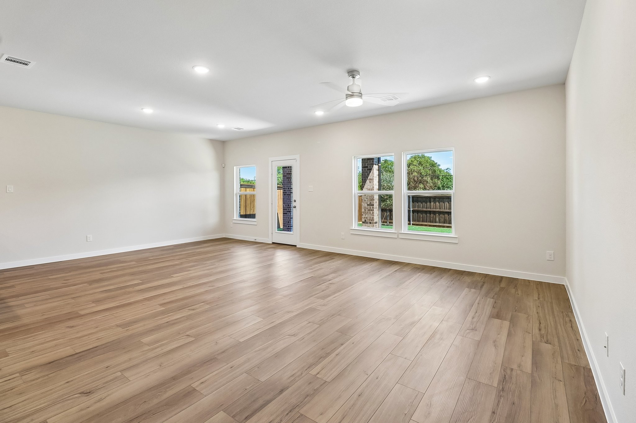 A room with a wood floor and a wood floor.
