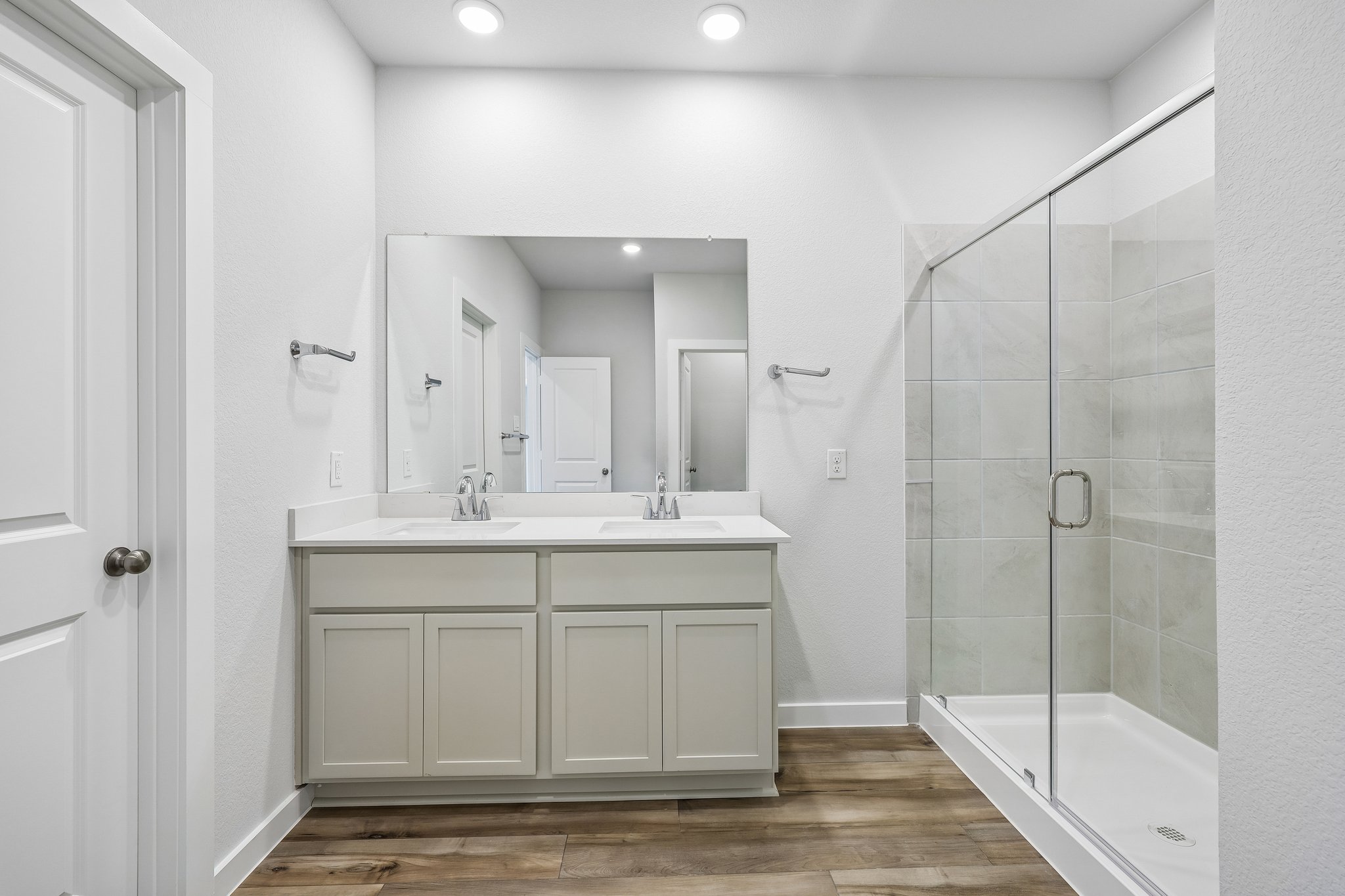 A bathroom with a glass shower.