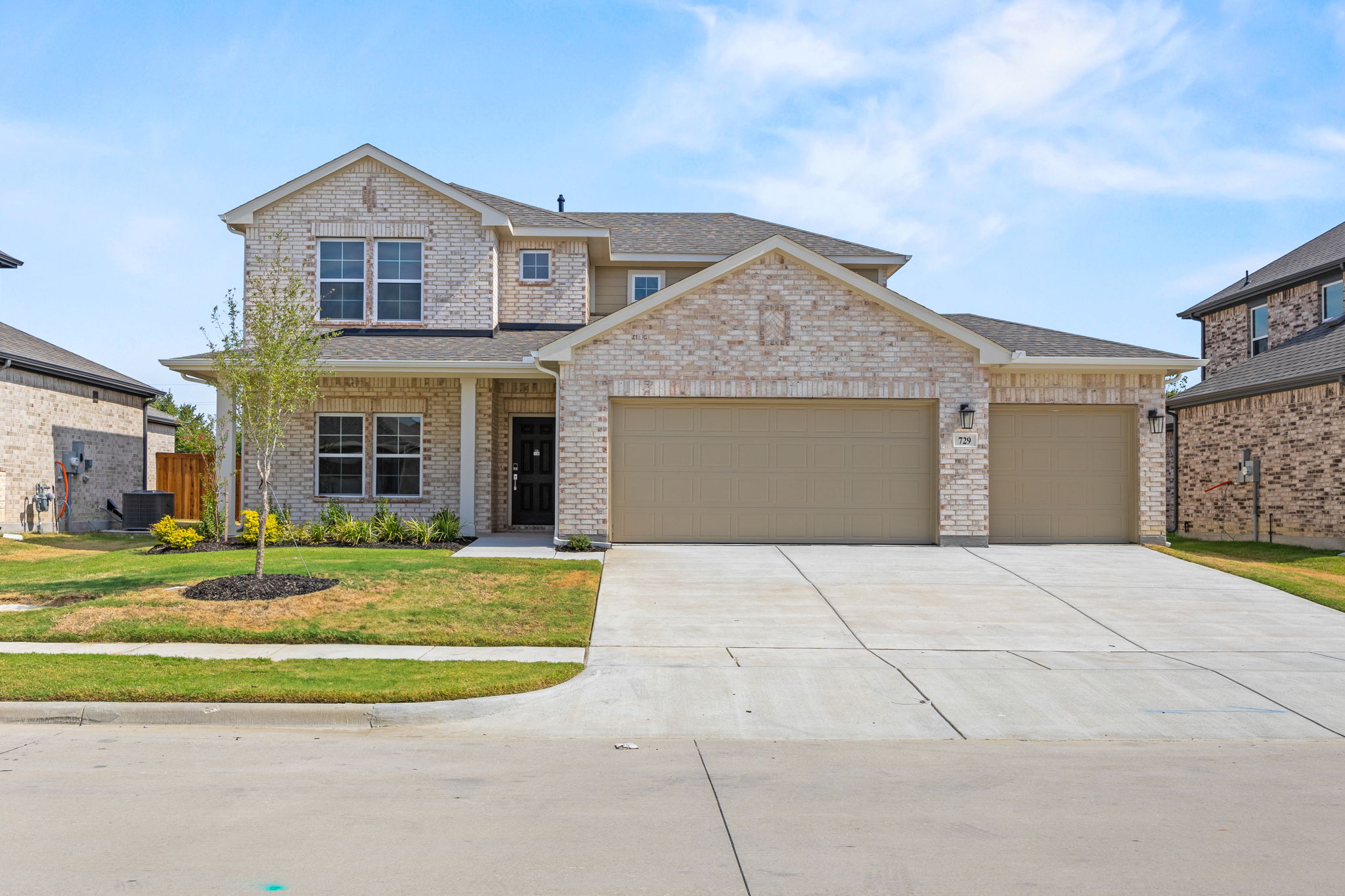 A large house with a driveway.