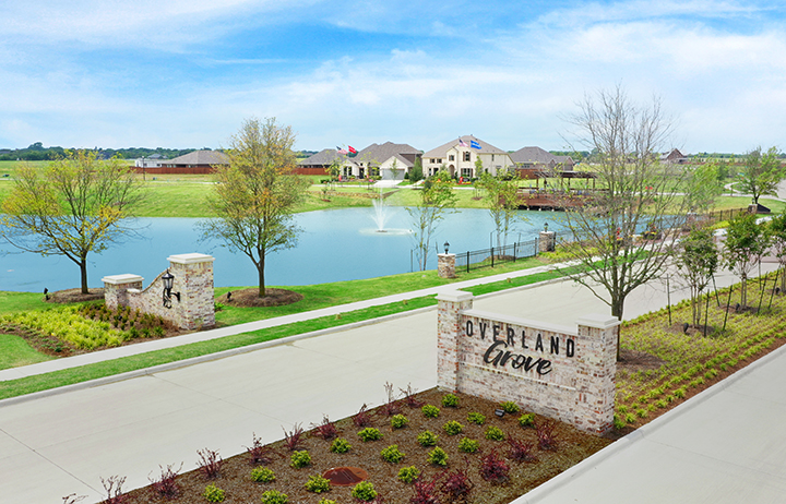 A body of water with trees and buildings around it.