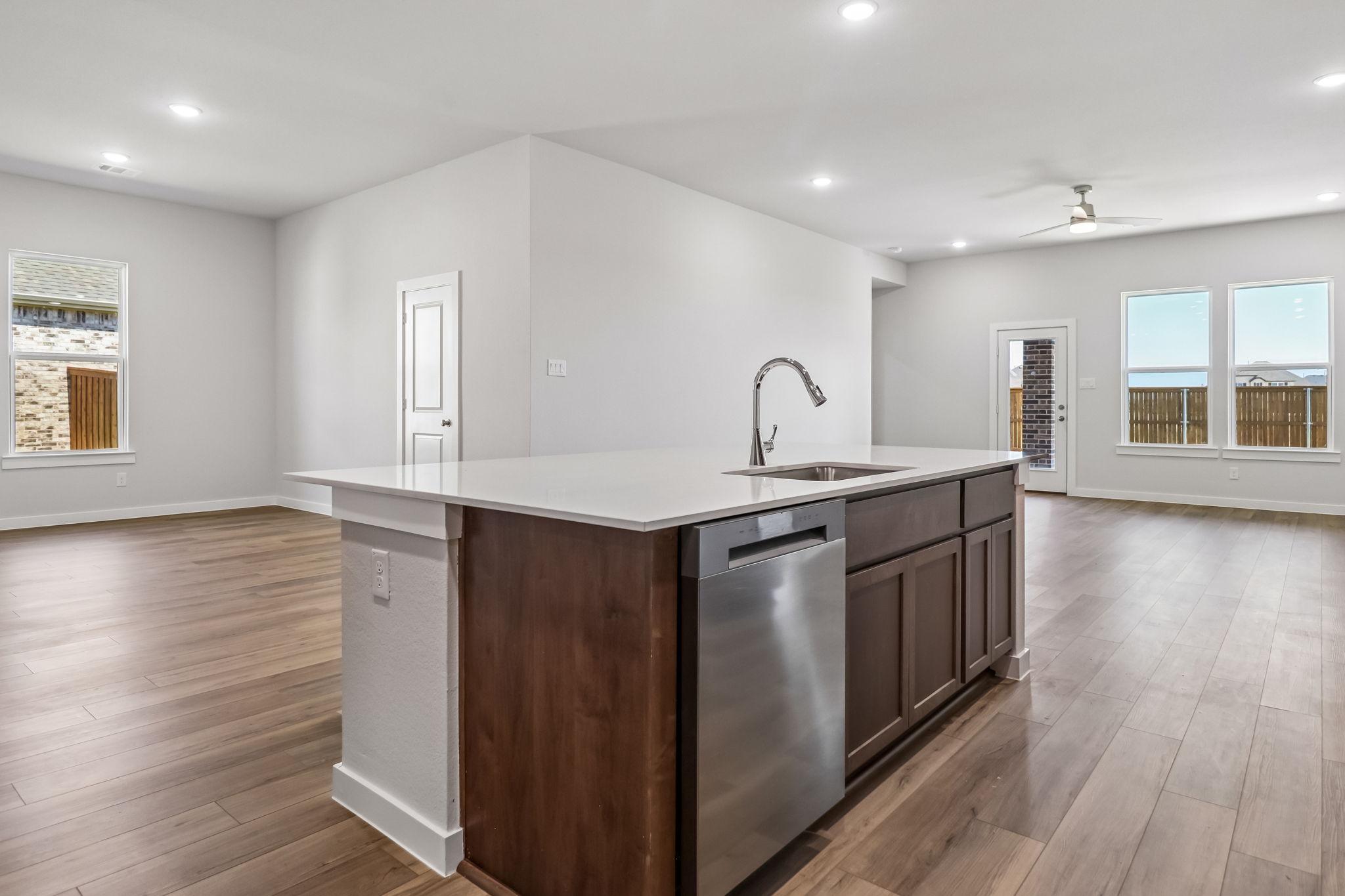 A kitchen with wooden floors.