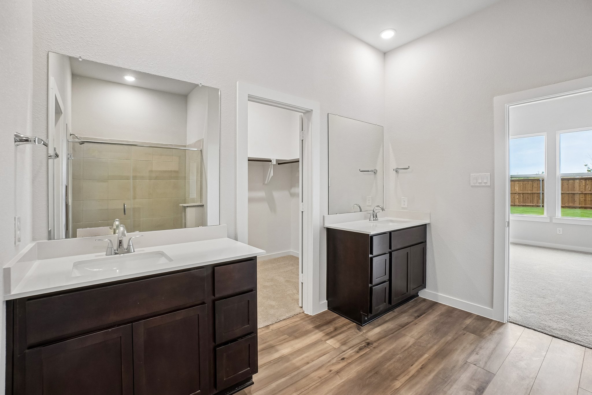 A bathroom with a large mirror.