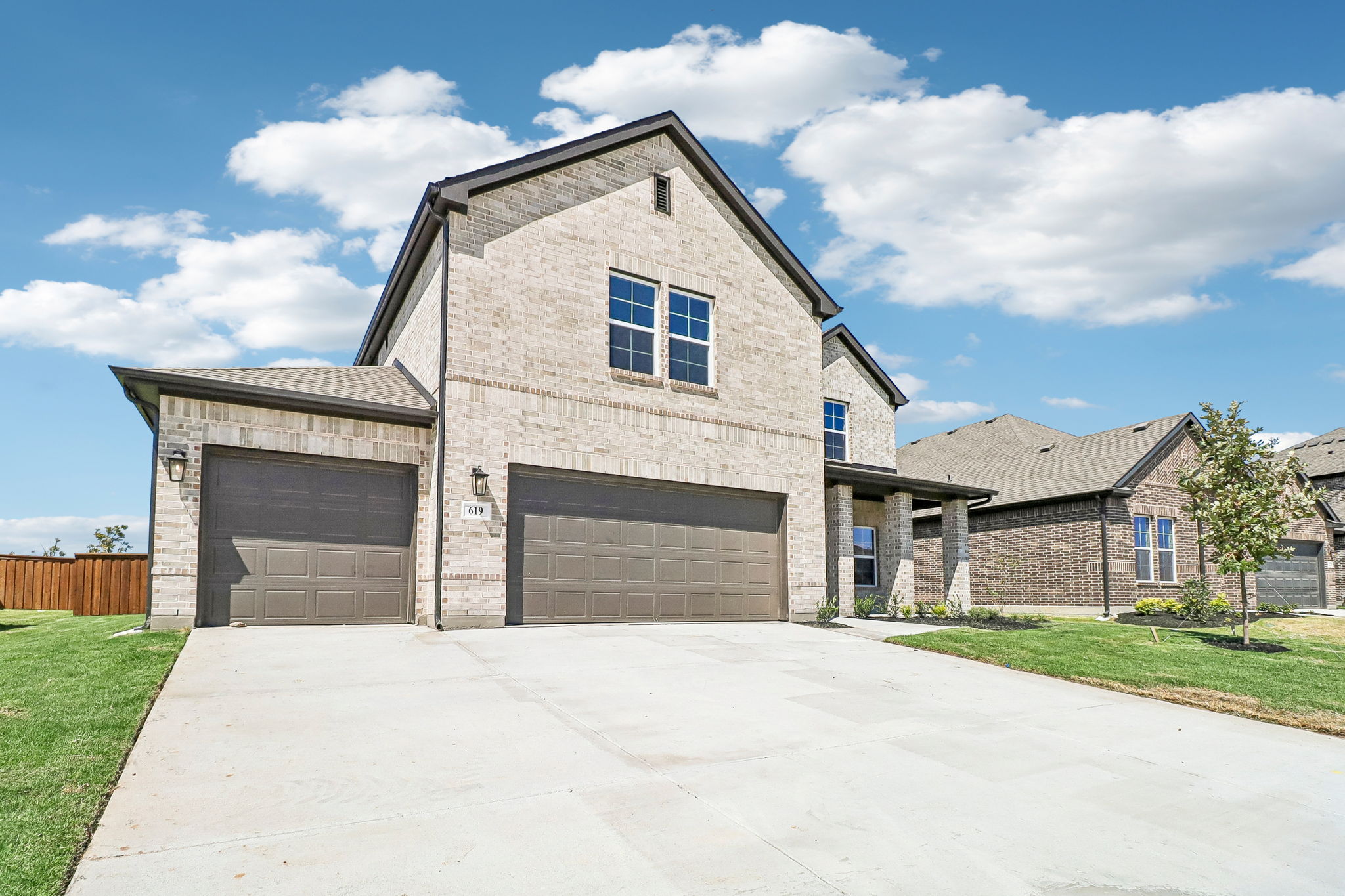 A building with garages and a driveway.