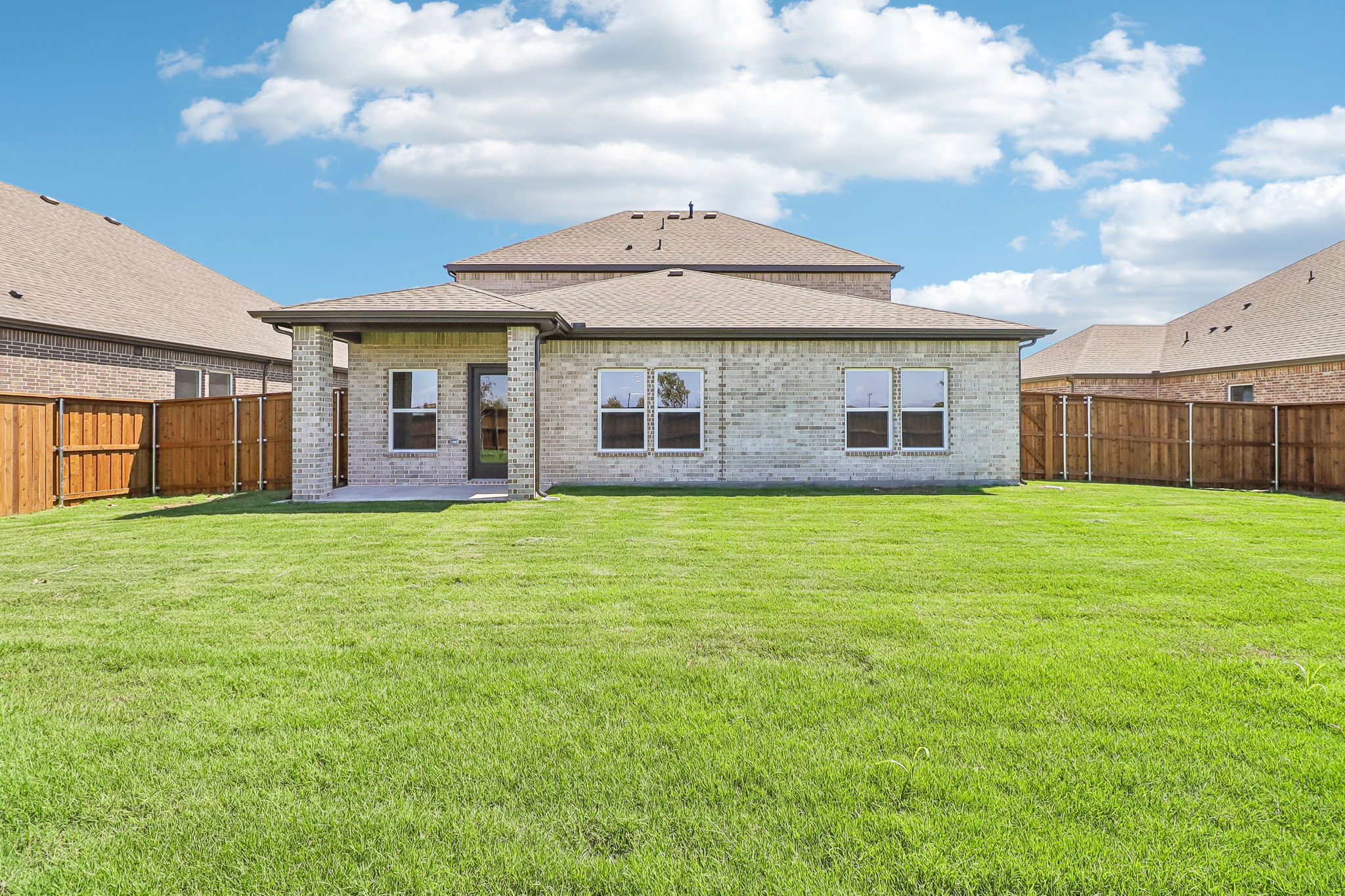 A house with a grass yard.