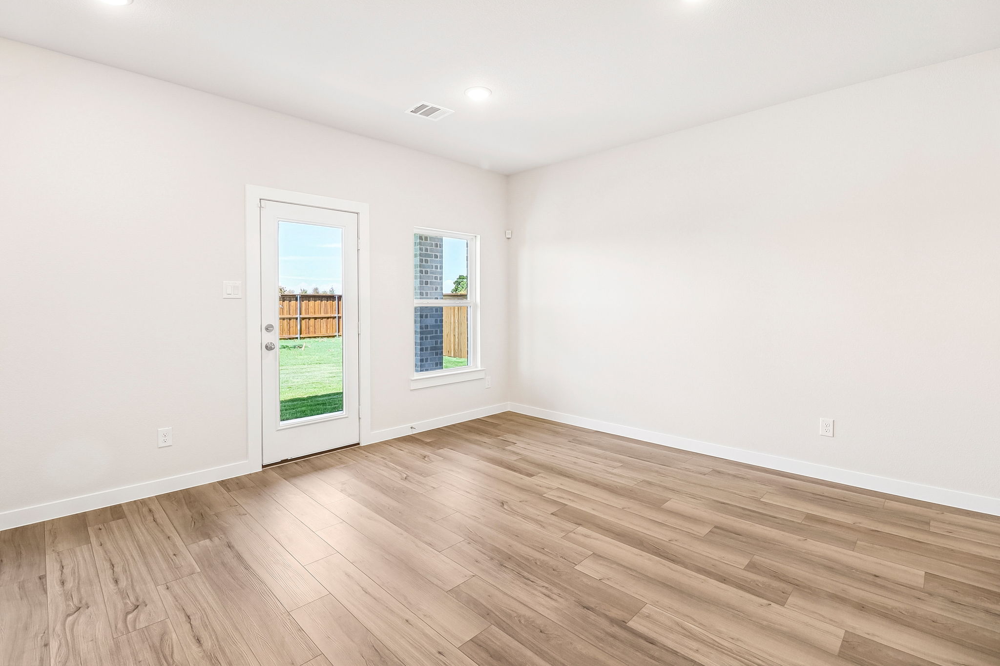 A room with a wood floor and a wood floor.