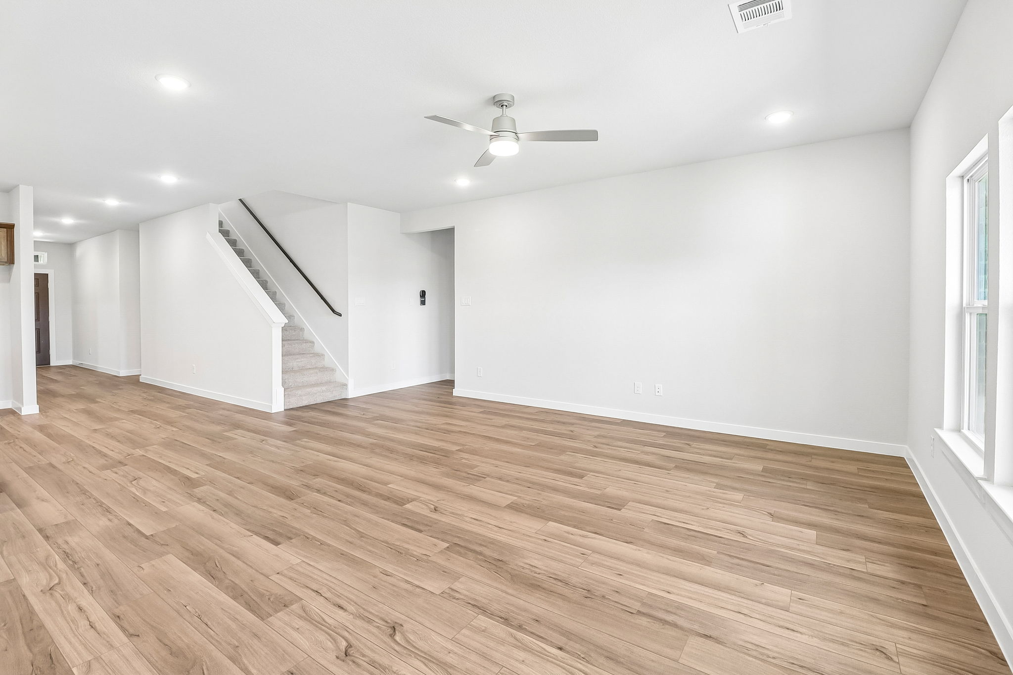 A room with a wood floor and a wood floor.