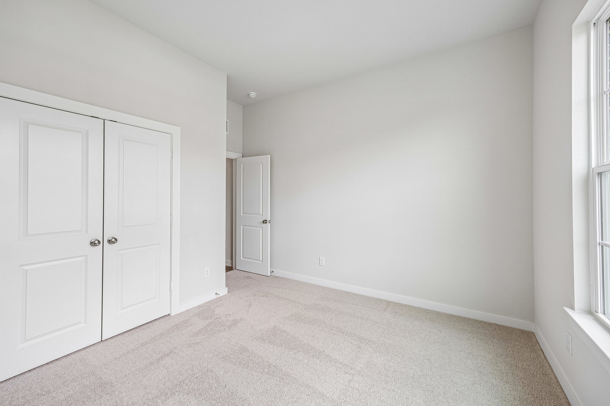 A room with white doors.