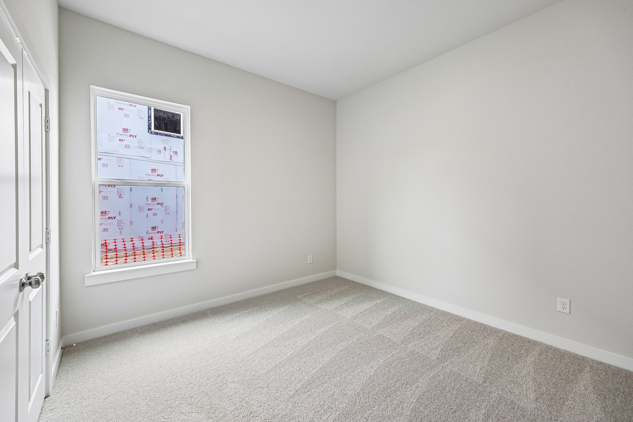 A room with a poster on the wall.