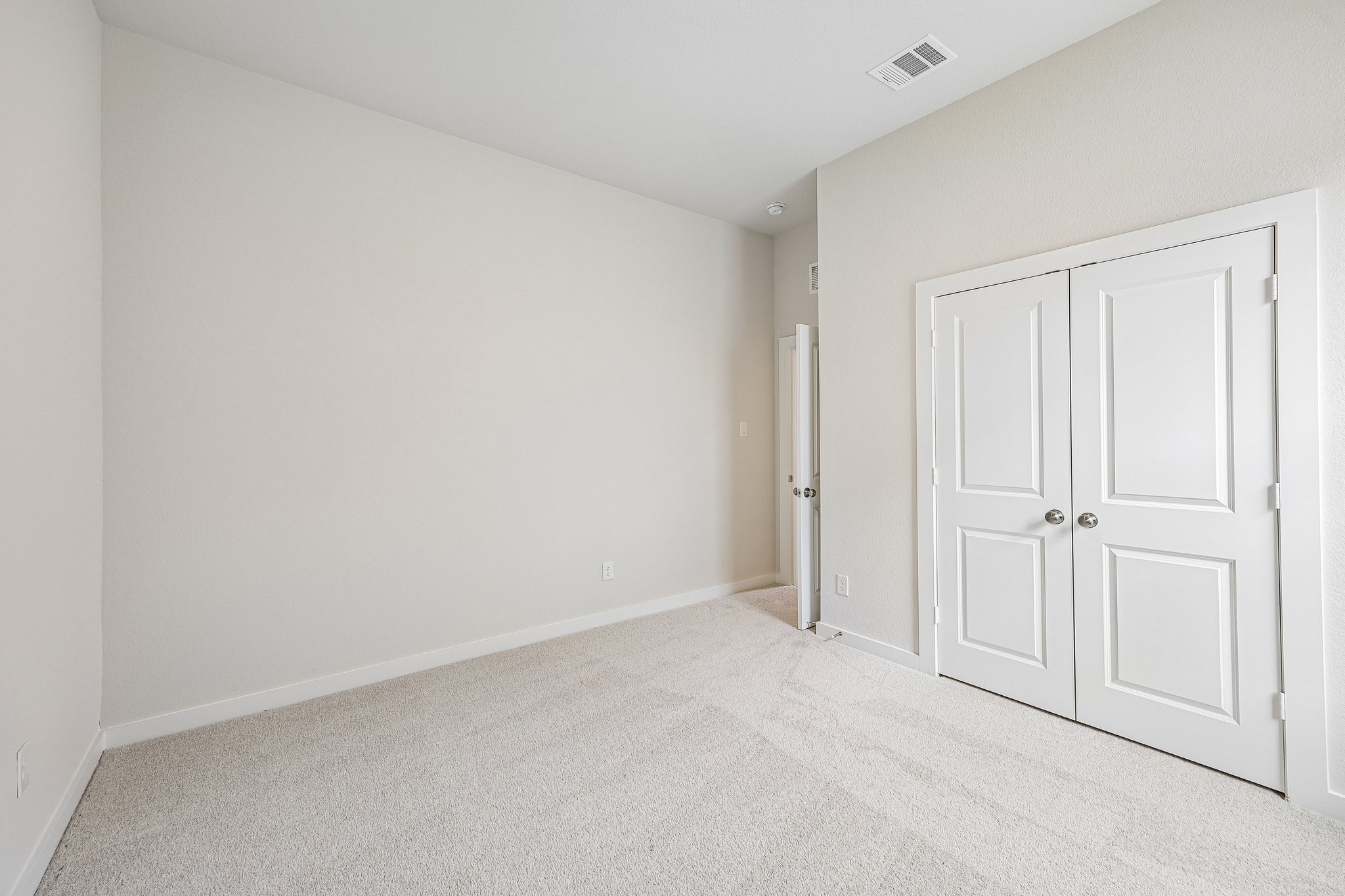 A room with white doors.