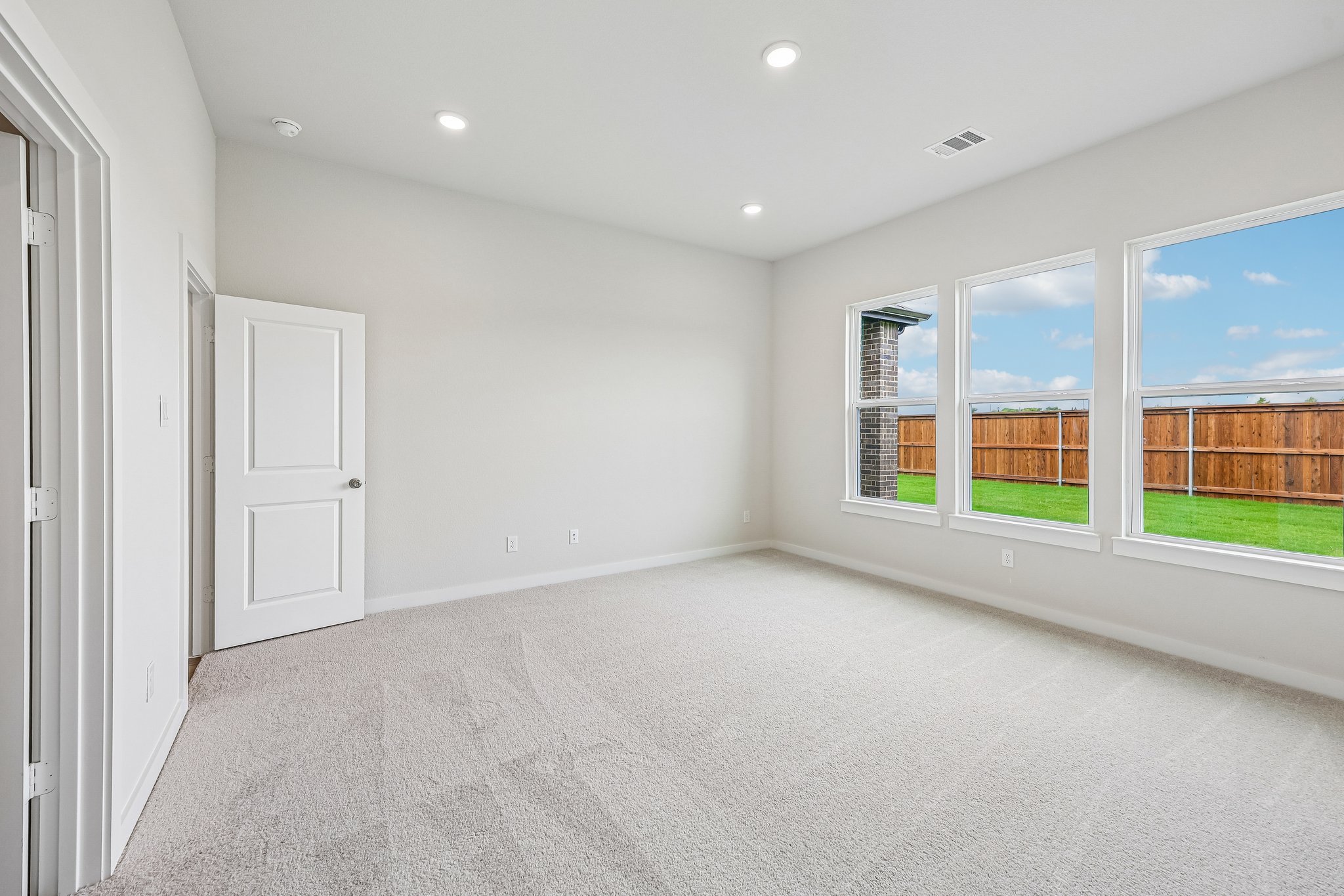 A room with a large window.