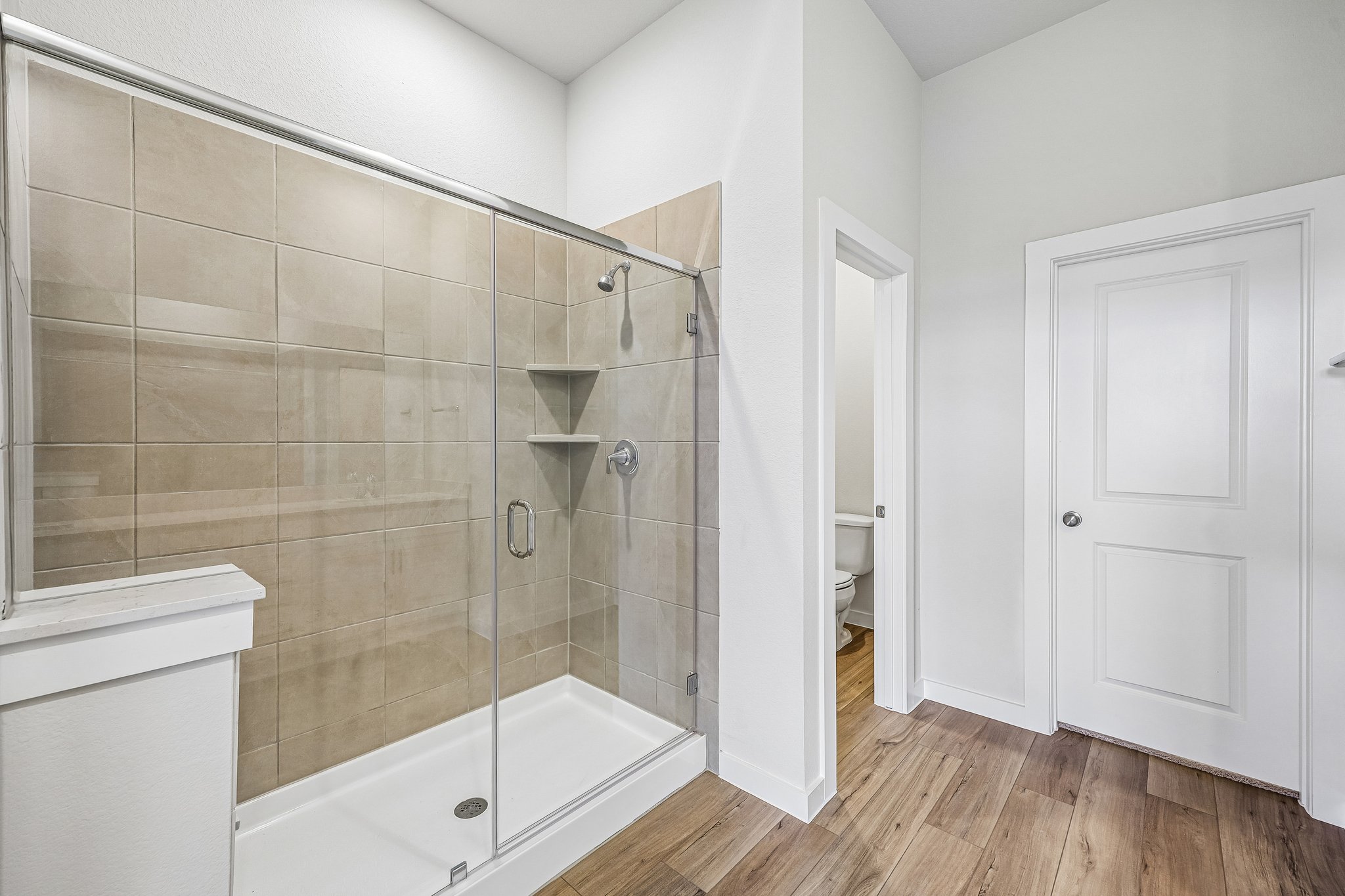 A bathroom with a glass shower.