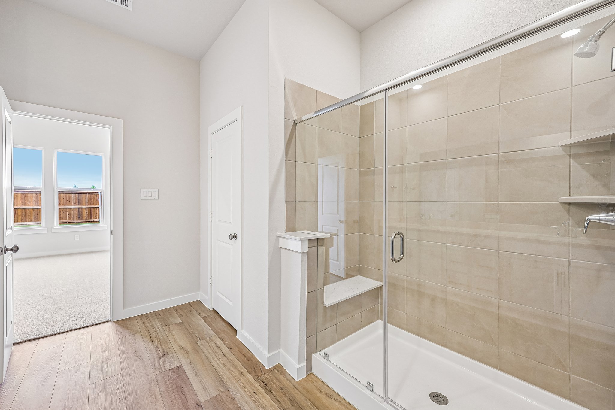A bathroom with a glass shower.