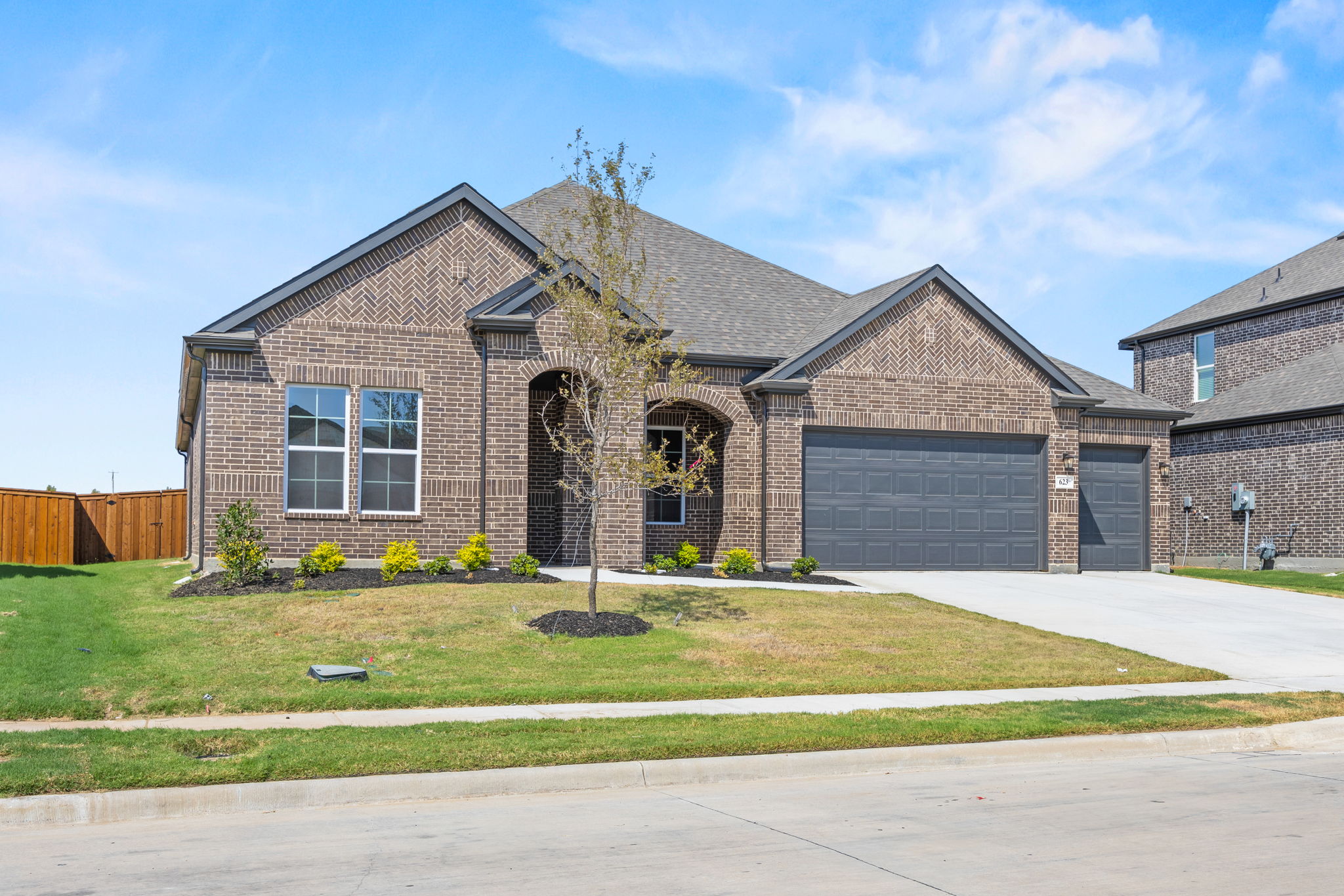 A house with a large front yard.