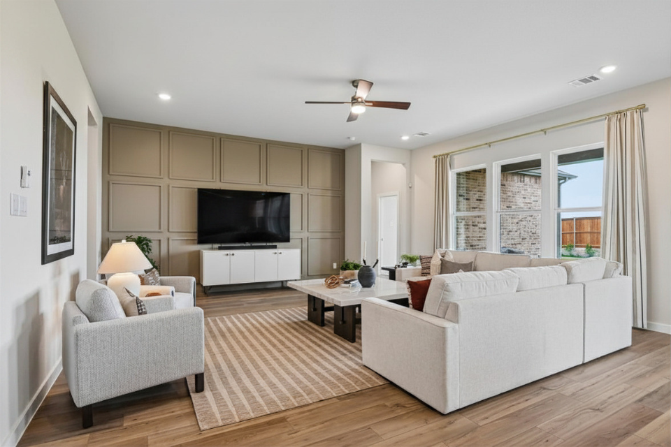 A living room with a tv and couches.