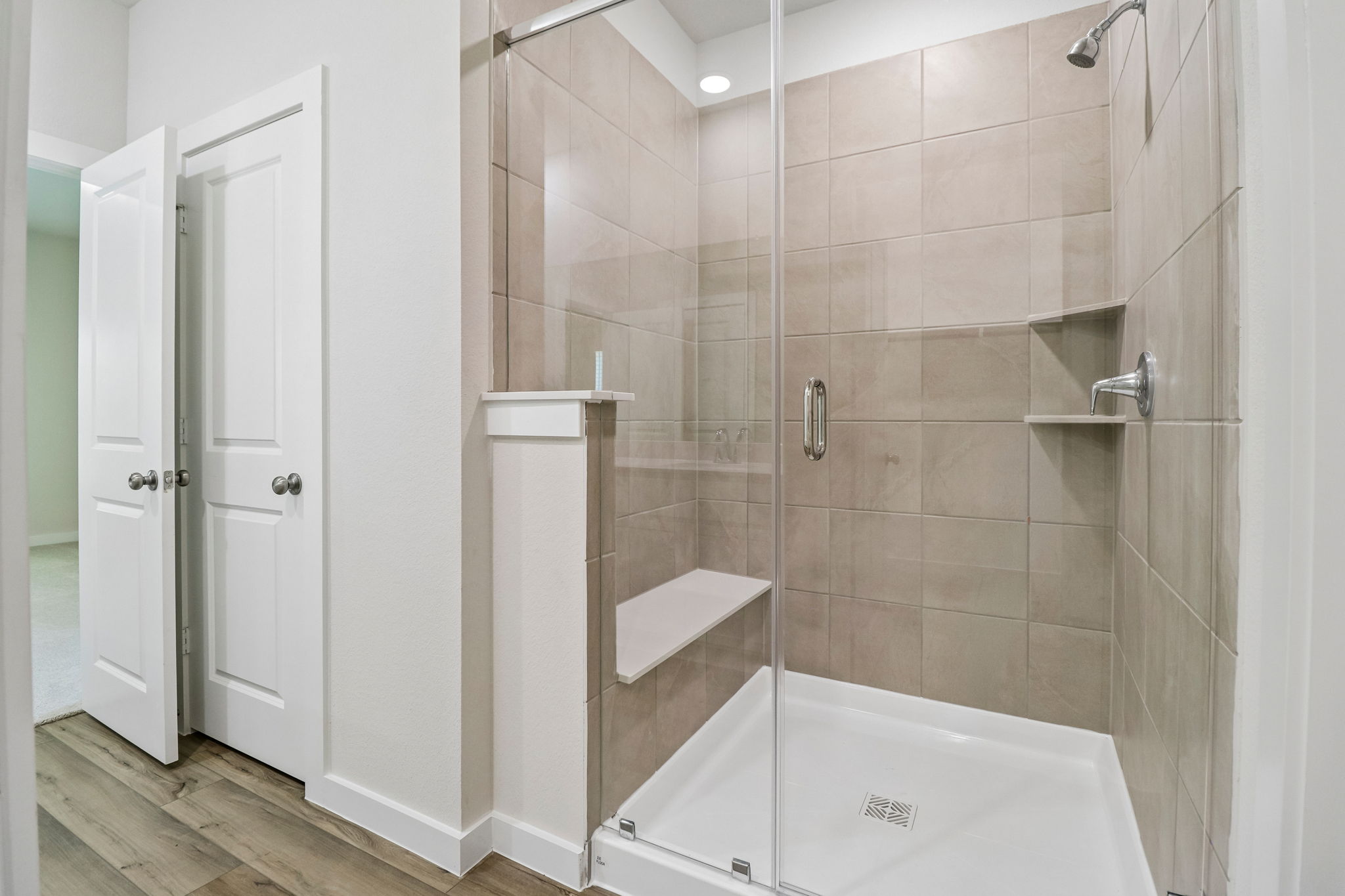 A bathroom with a glass shower.
