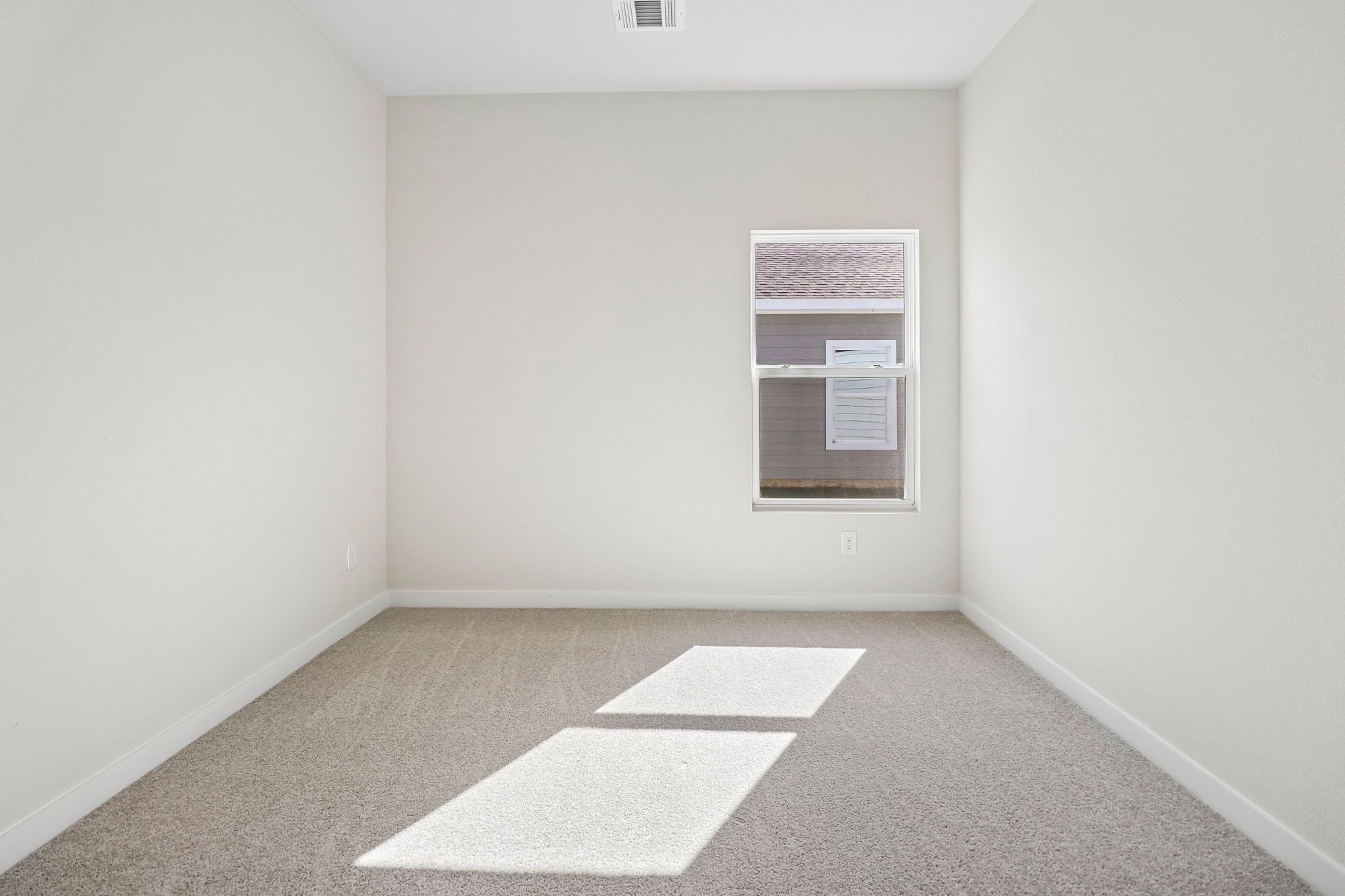 A room with a door and a window.