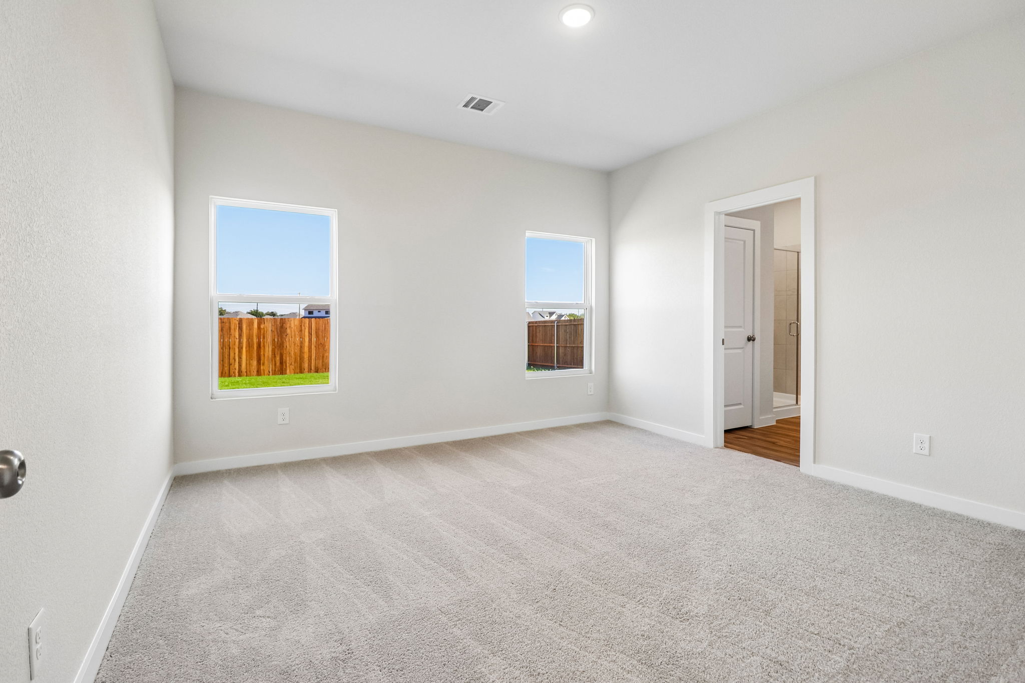 A room with a window and a door.