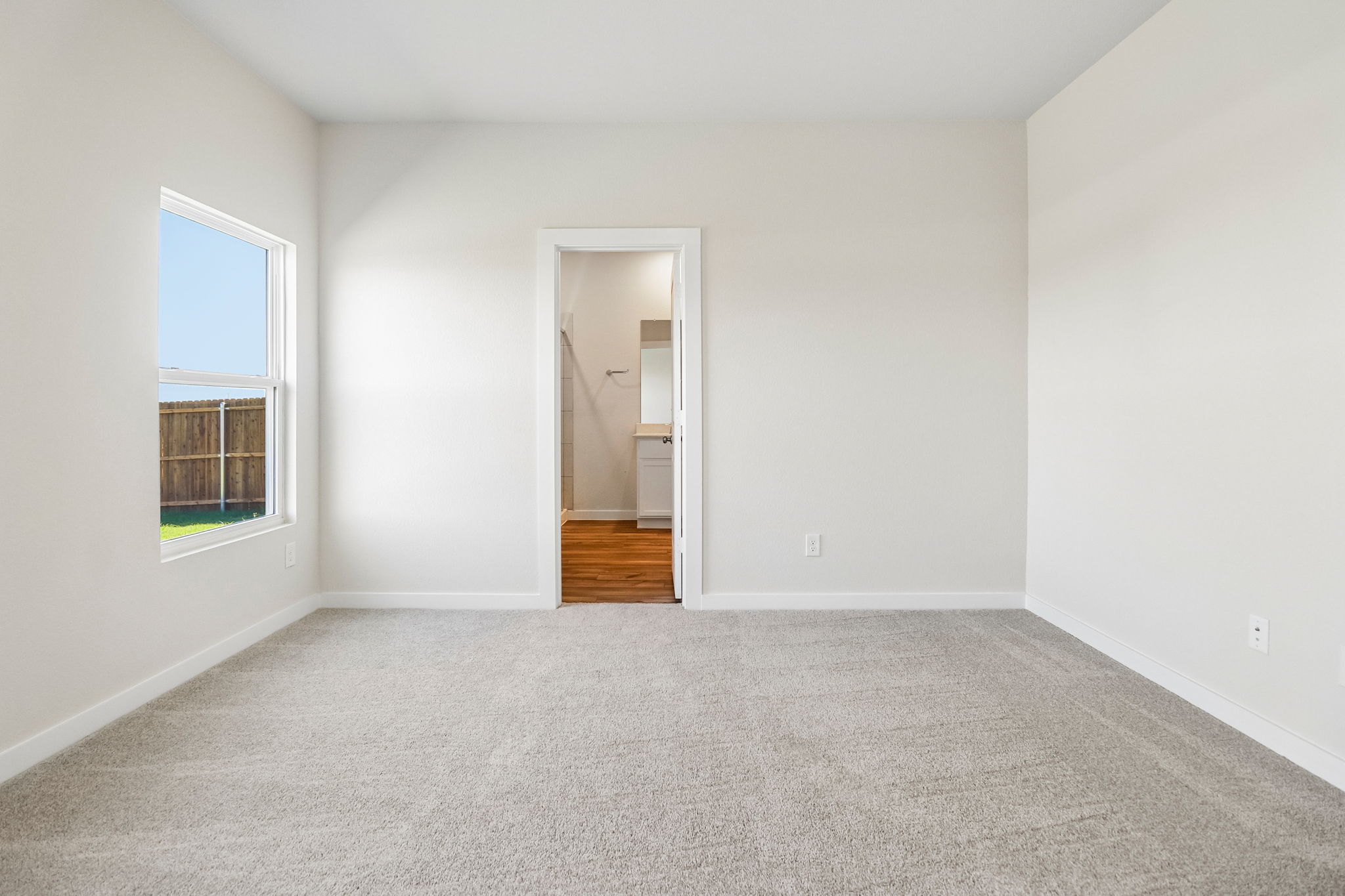A room with a door and a window.
