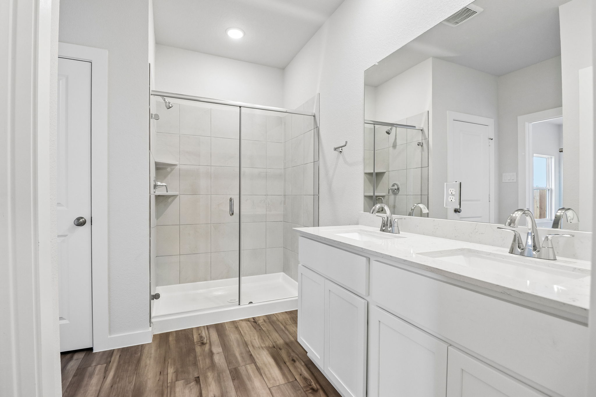 A bathroom with a glass shower.