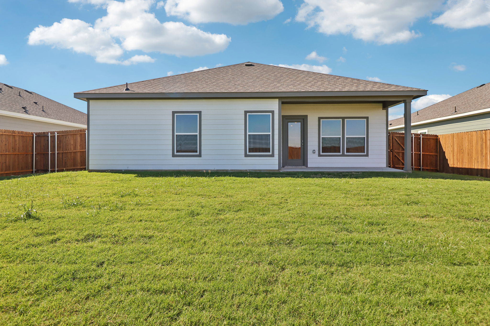 A house with a grass yard.