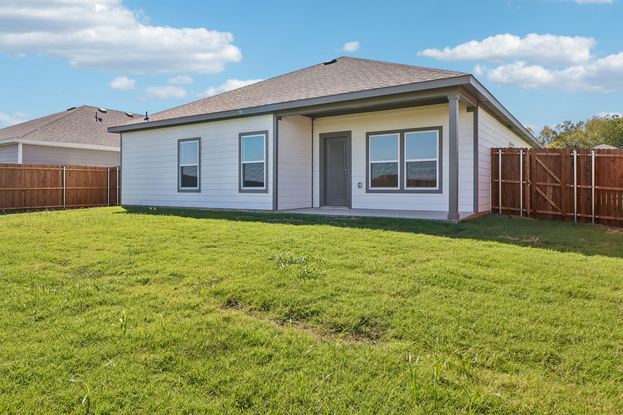 A house with a fence around it.
