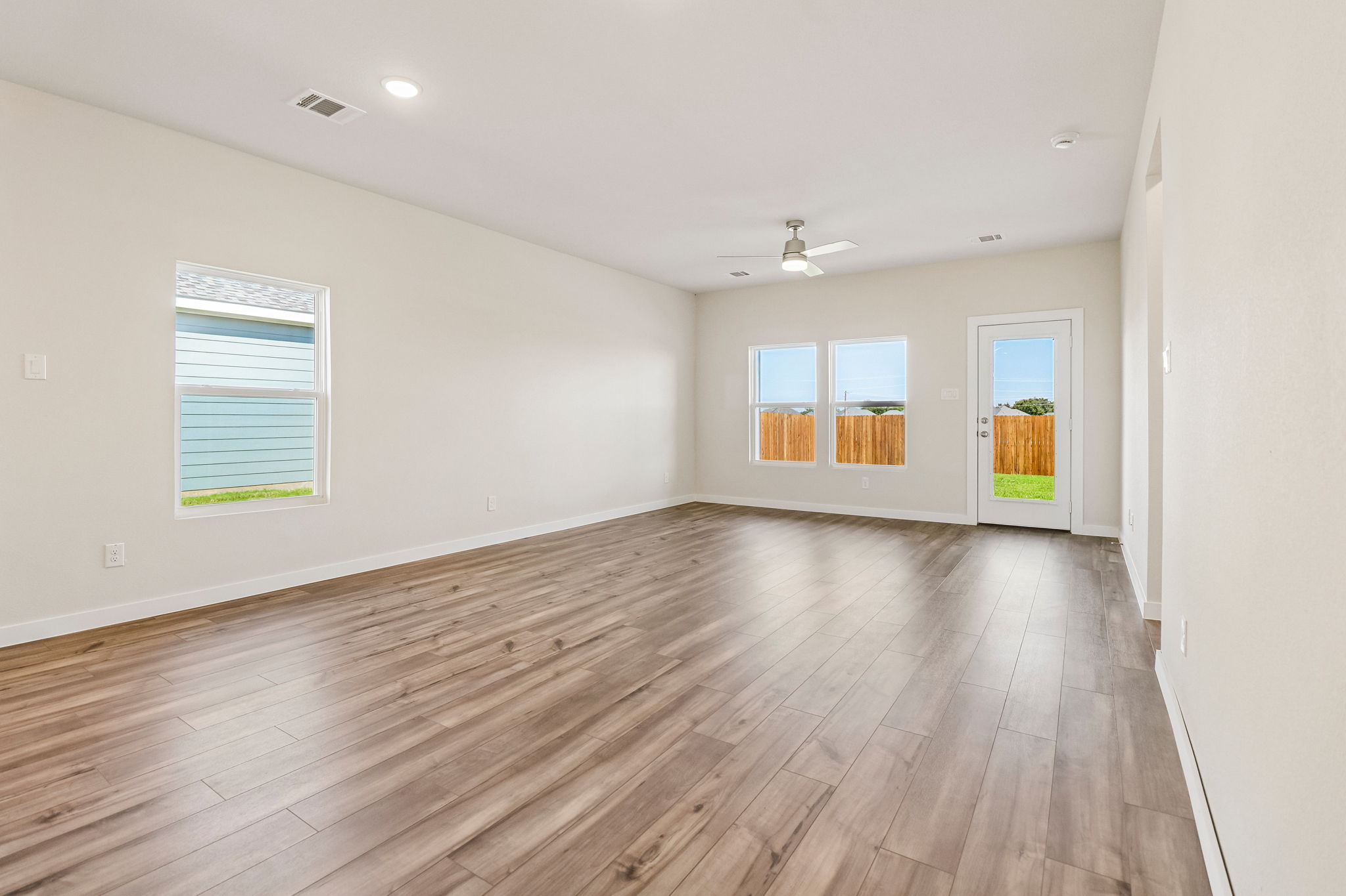 A room with a wood floor and a wood floor.