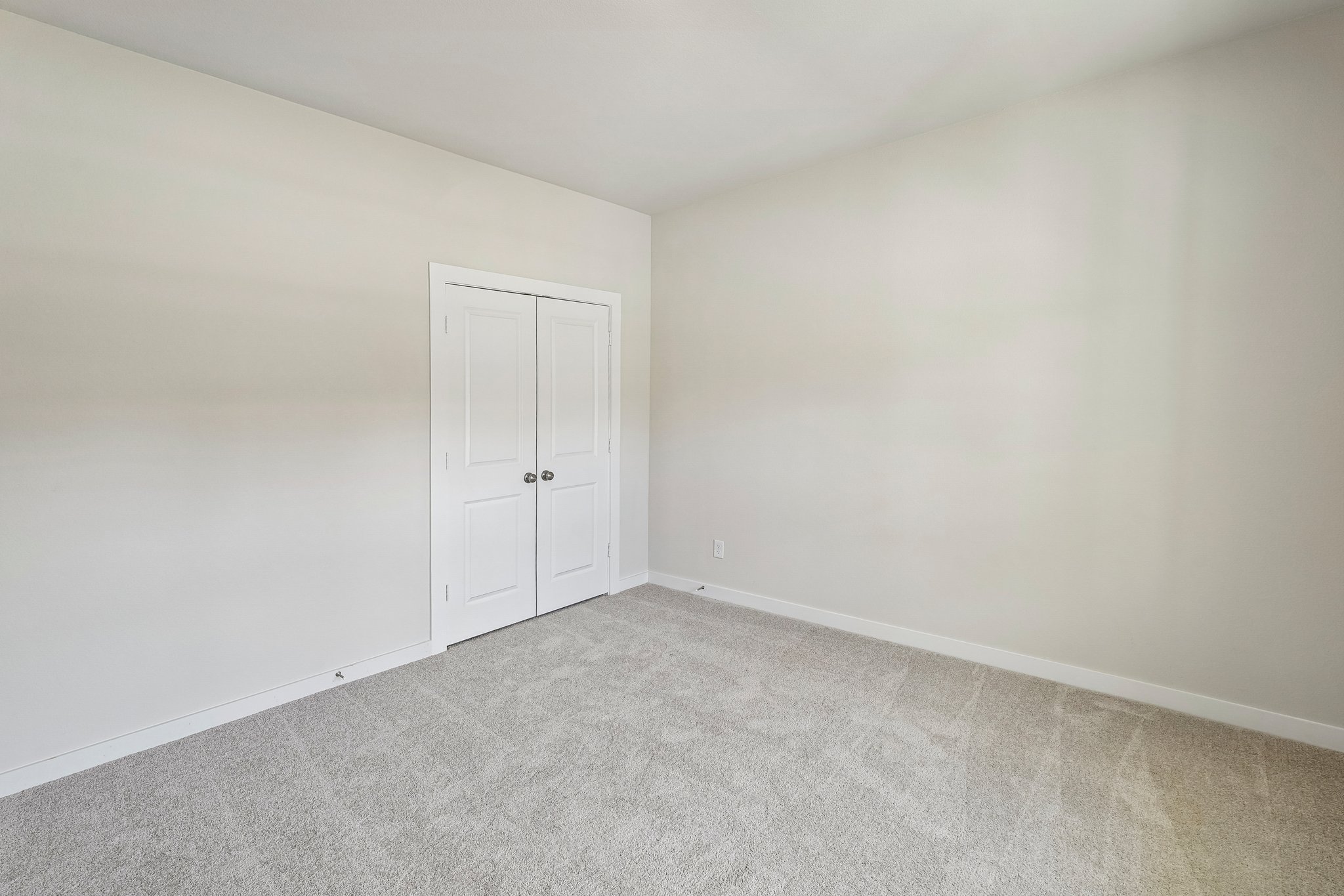 A room with white doors.