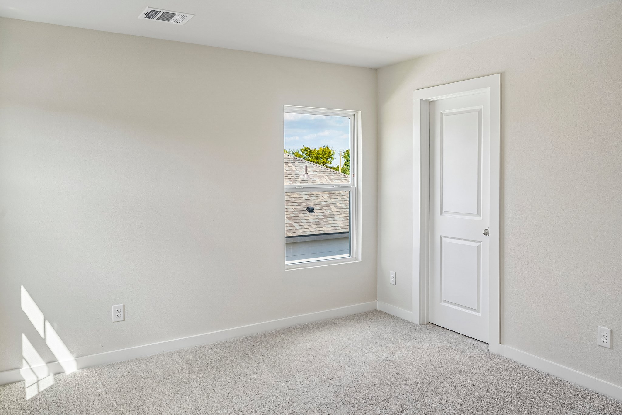 A room with a door and a window.
