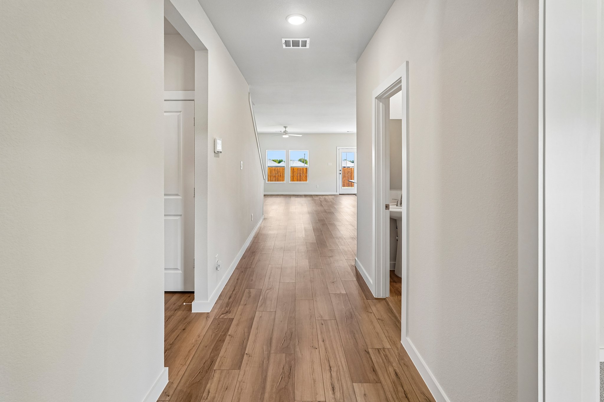 A hallway with white walls.