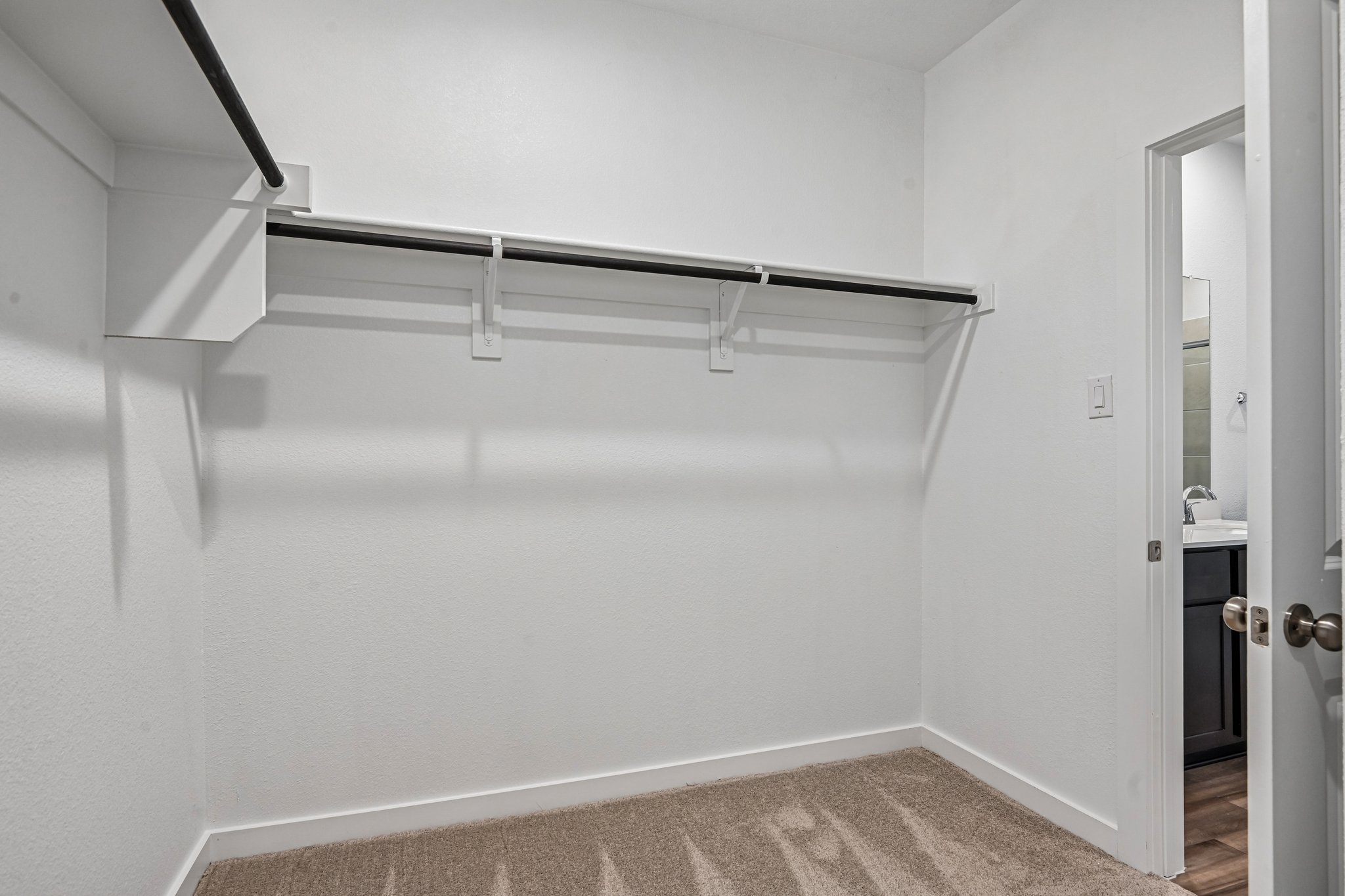 A white staircase in a room.