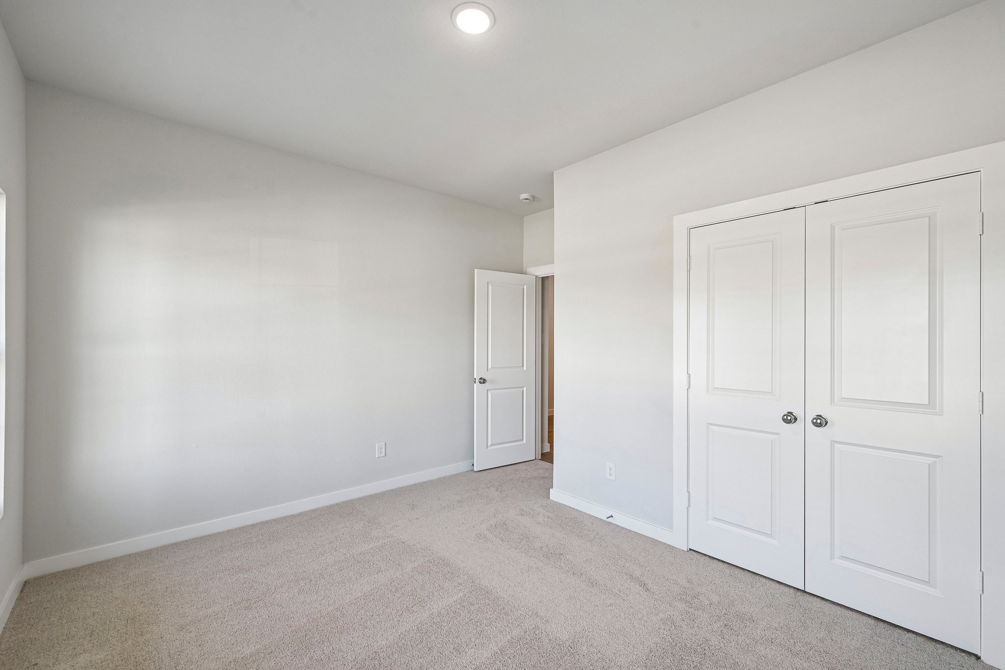 A room with white doors.