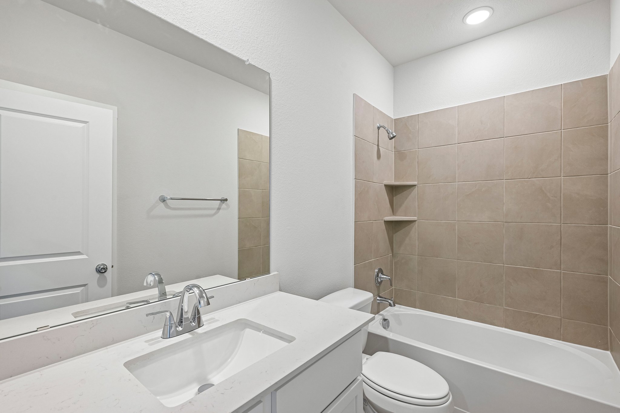 A bathroom with a sink and a toilet.