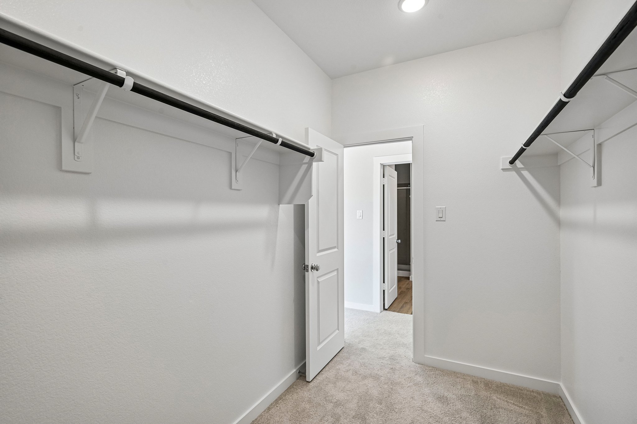 A hallway with white walls.