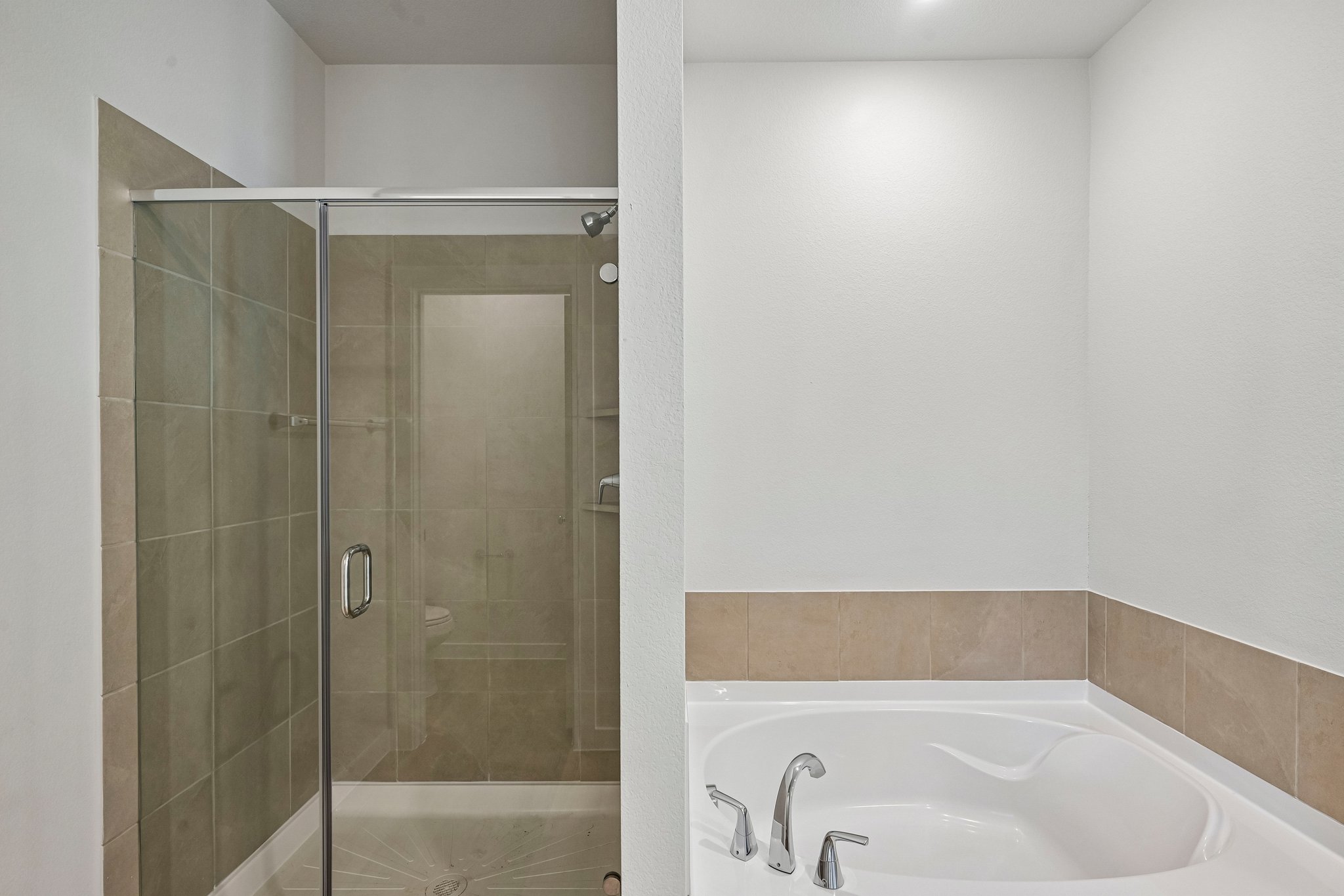 A bathroom with a glass shower.