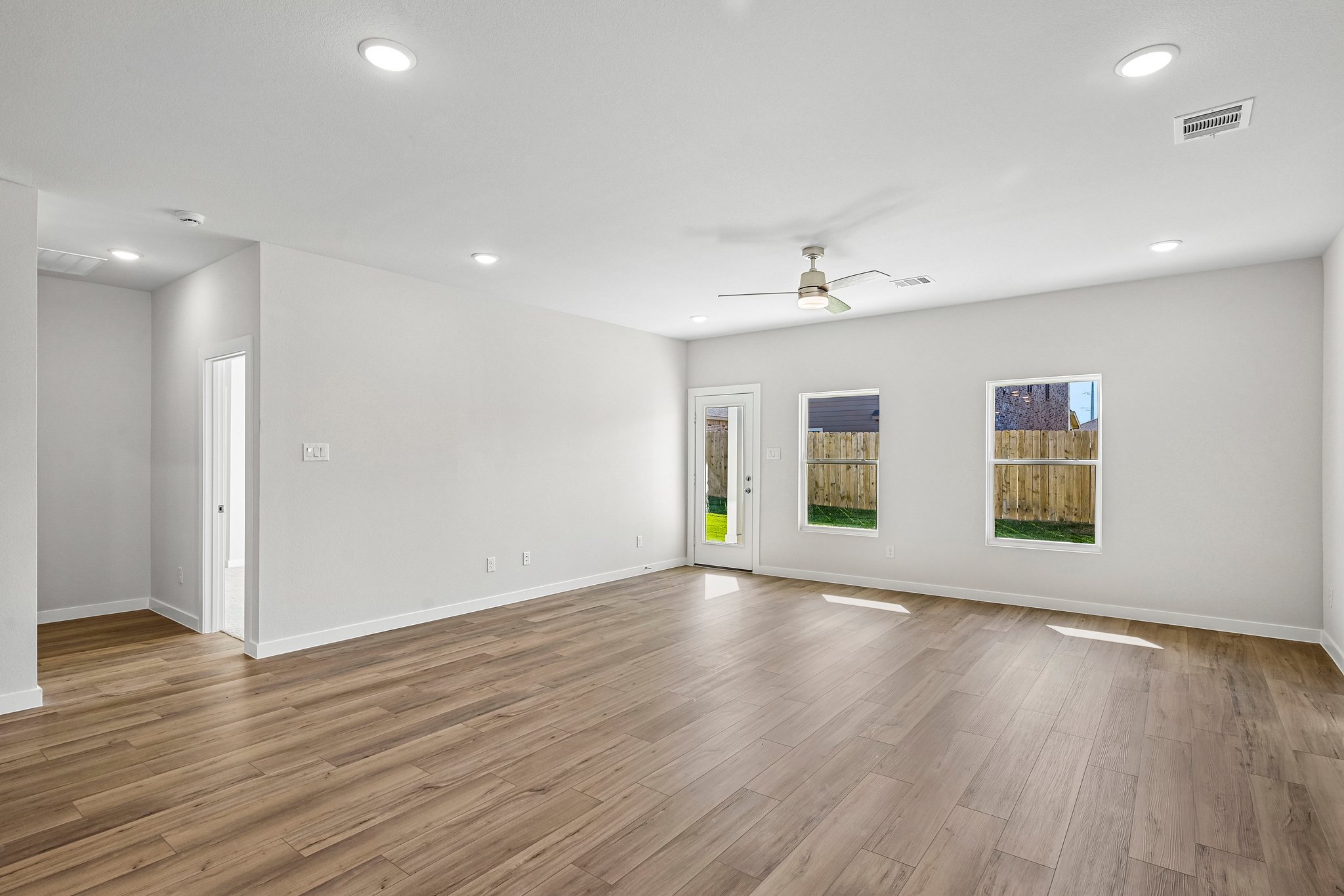 A room with a wood floor and a wood floor.