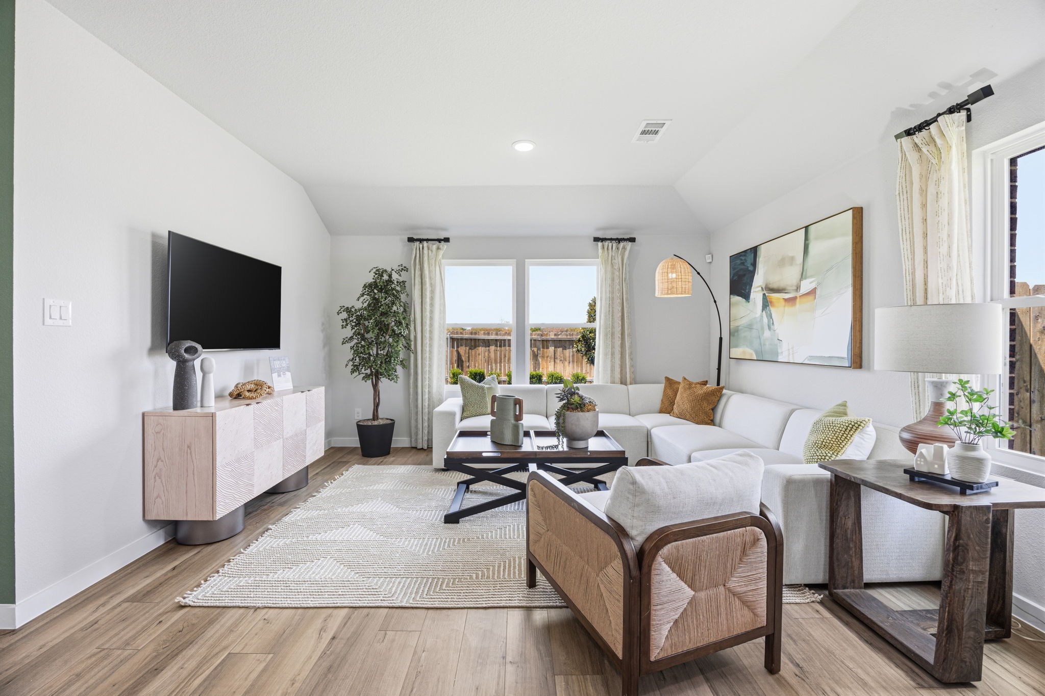 A living room with a large window.