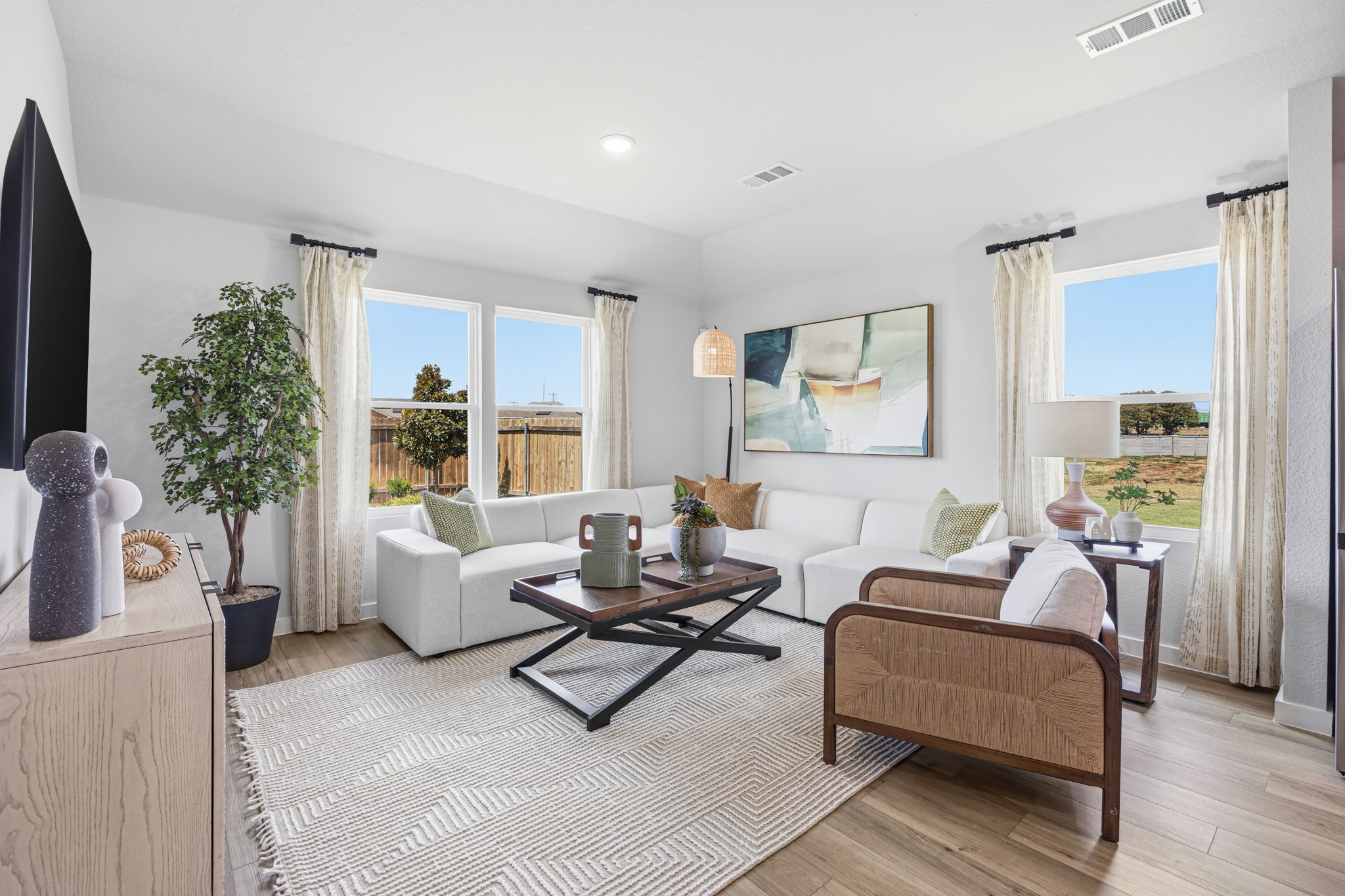 A living room with a large window.