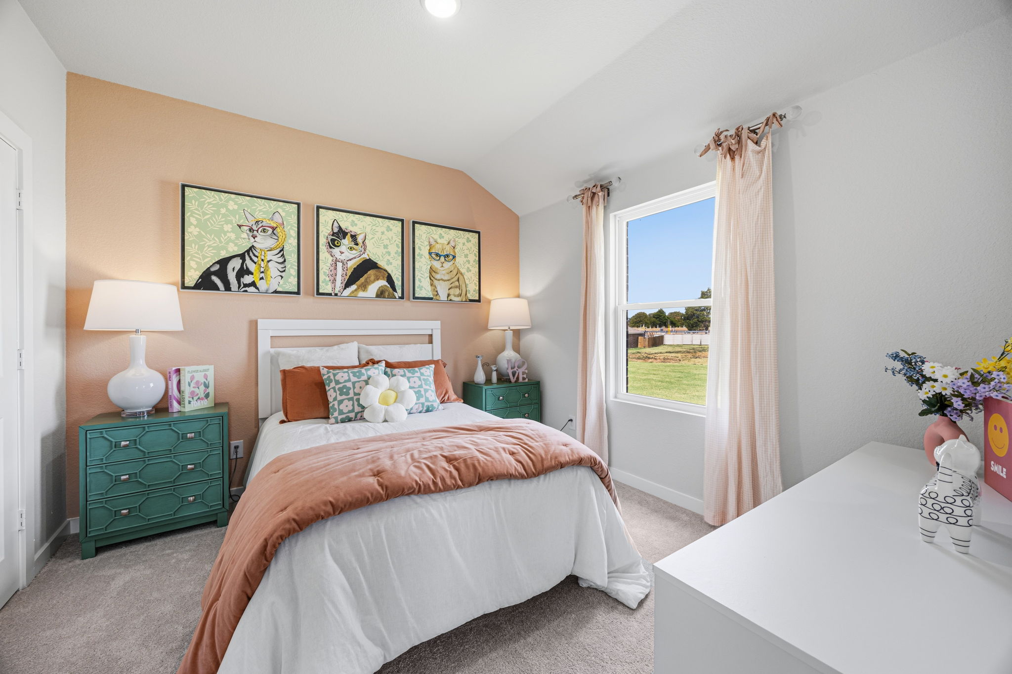 A bedroom with a large window.