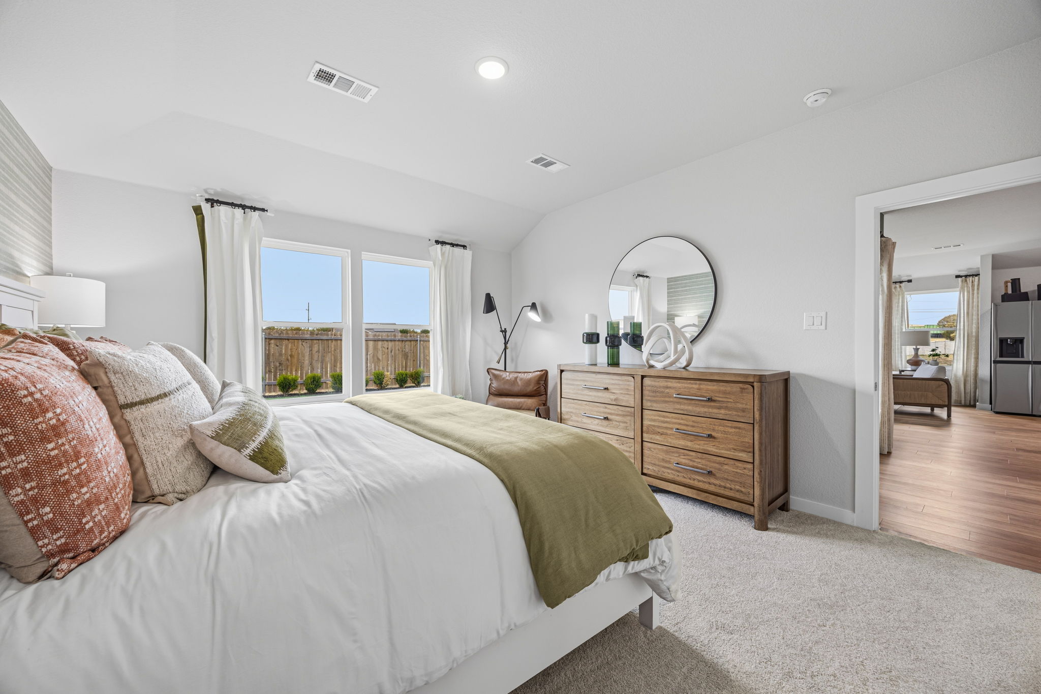A bedroom with a large bed.