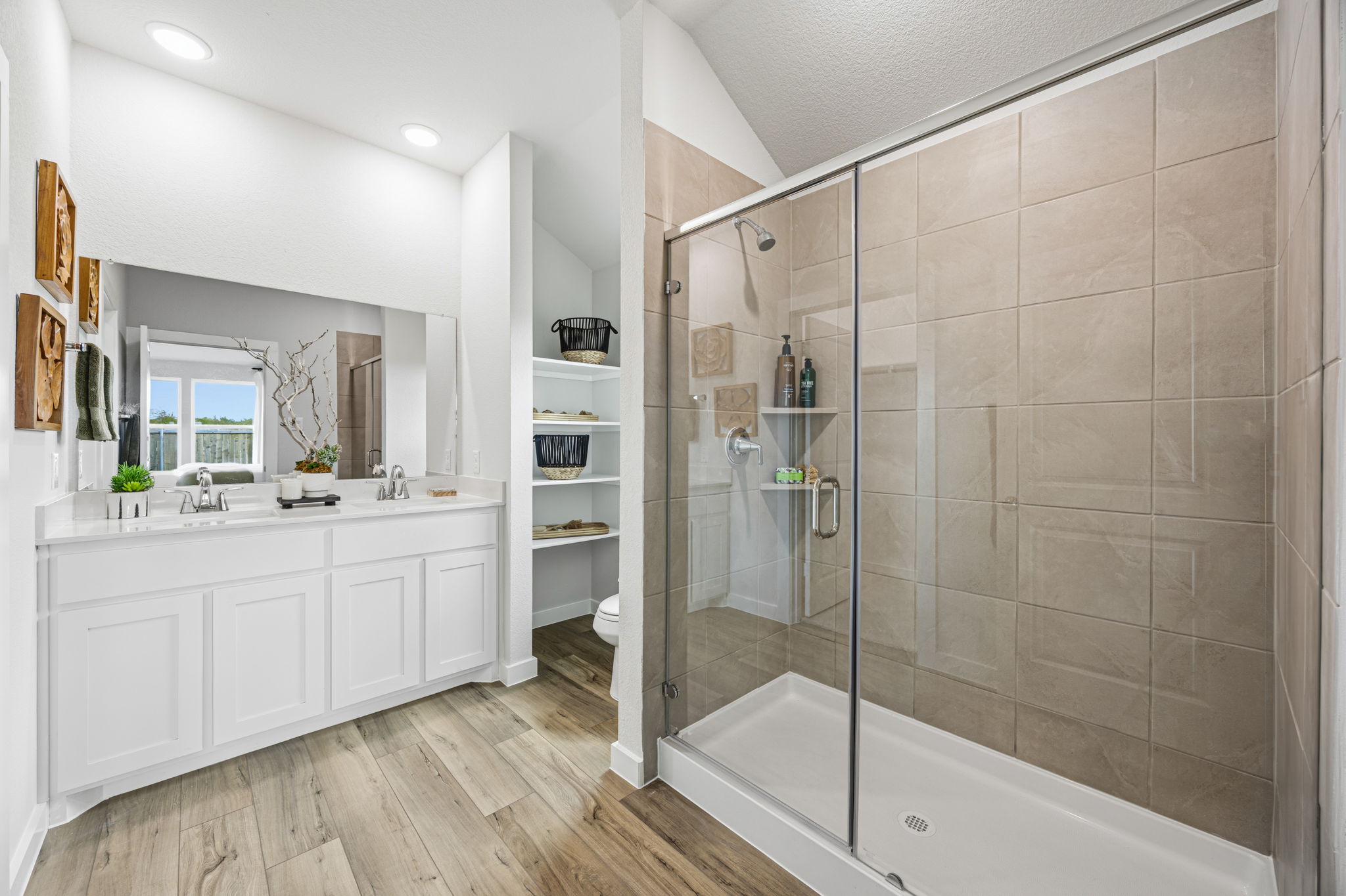 A bathroom with a glass shower.