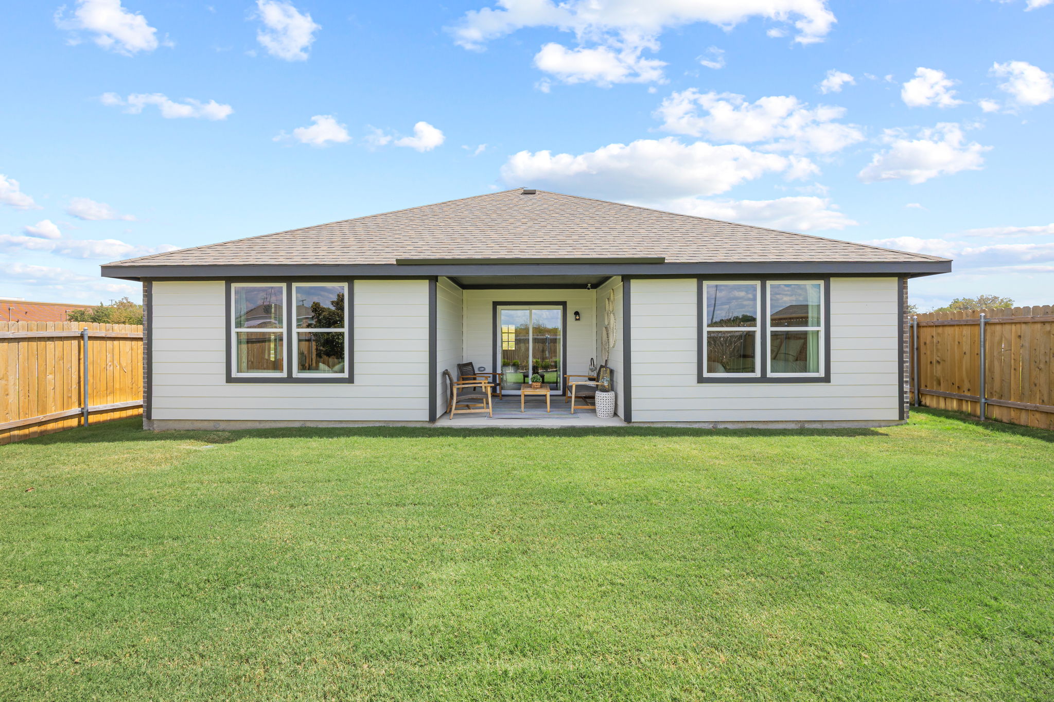 A house with a grass yard.