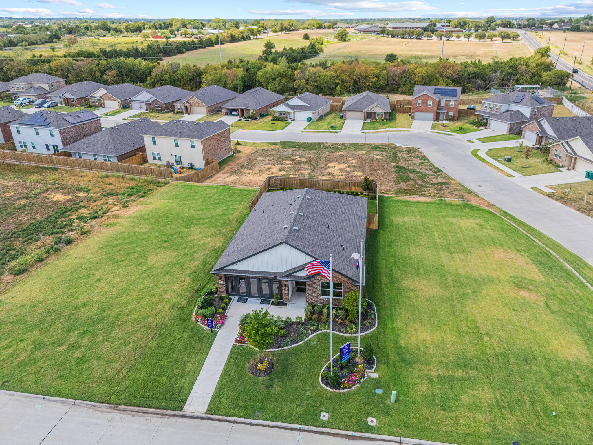 A group of houses in a grassy area.