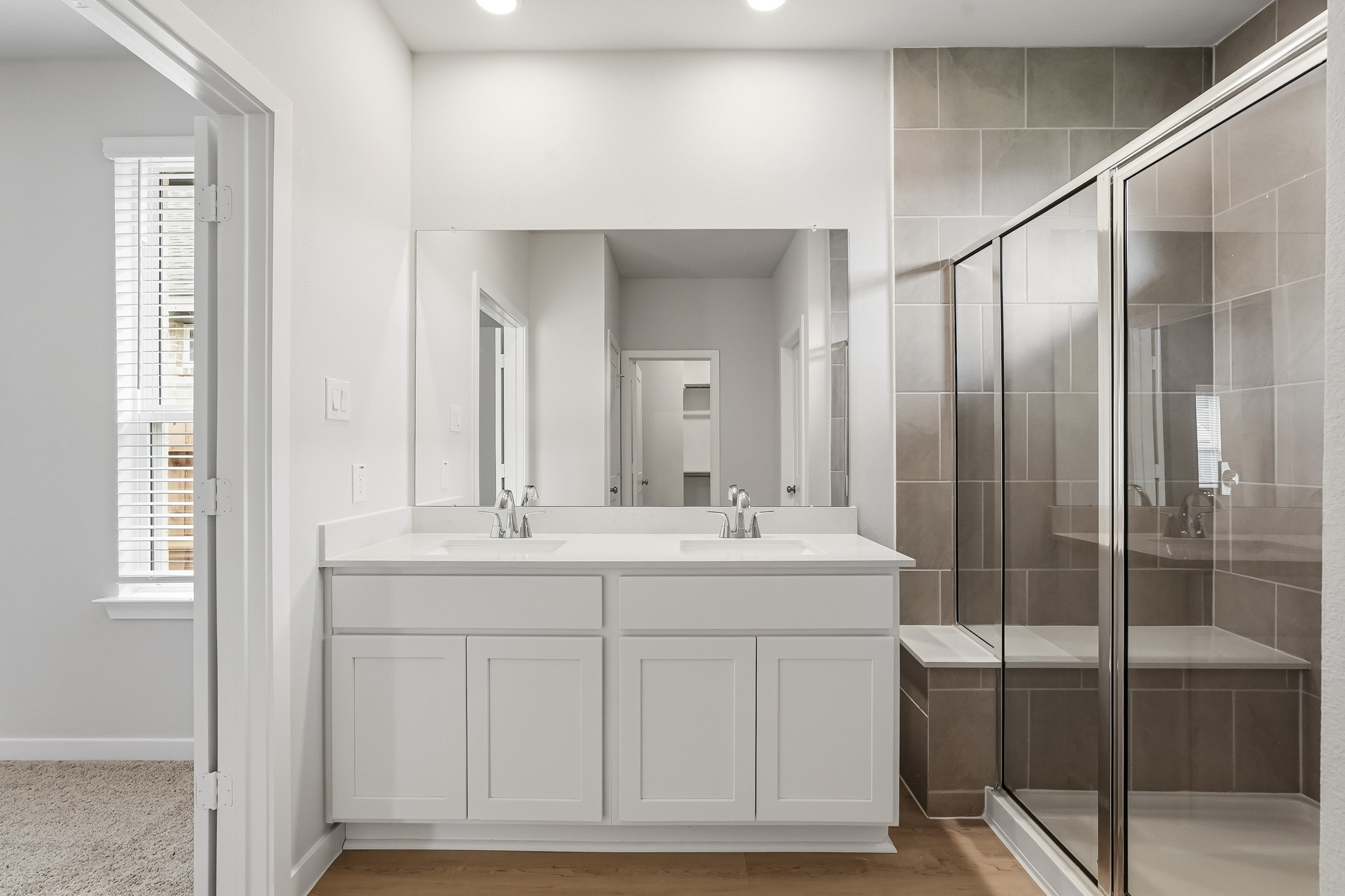 A bathroom with a glass shower.